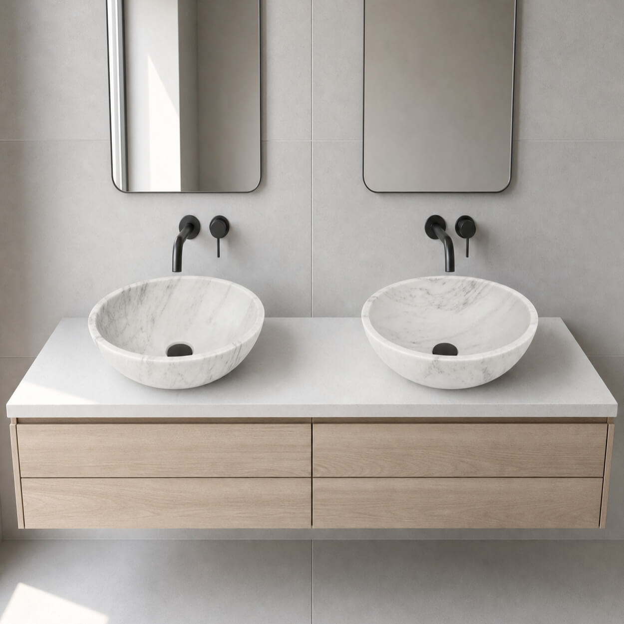 Snow Mountain white marble vessel sinks on light oak vanity, matte black wall faucets, Scandinavian minimalist bathroom.