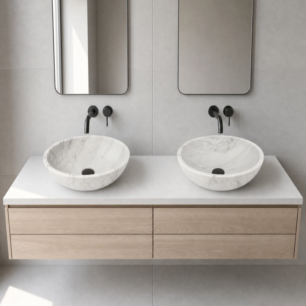 Snow Mountain white marble vessel sinks on light oak vanity, matte black wall faucets, Scandinavian minimalist bathroom.