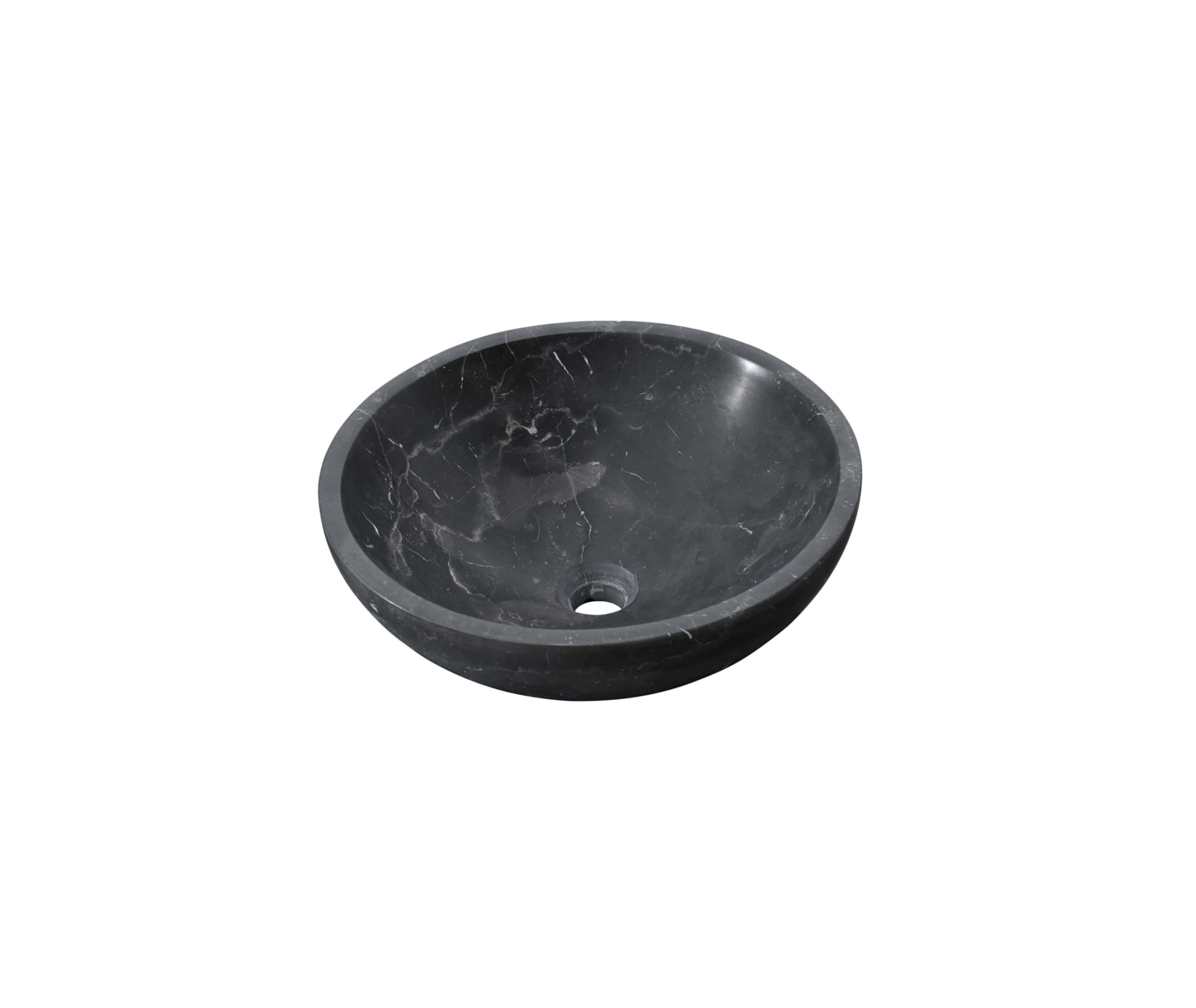 Black marble vessel sink showing prominent white lightning veining across the honed interior basin, single-block carved construction.
