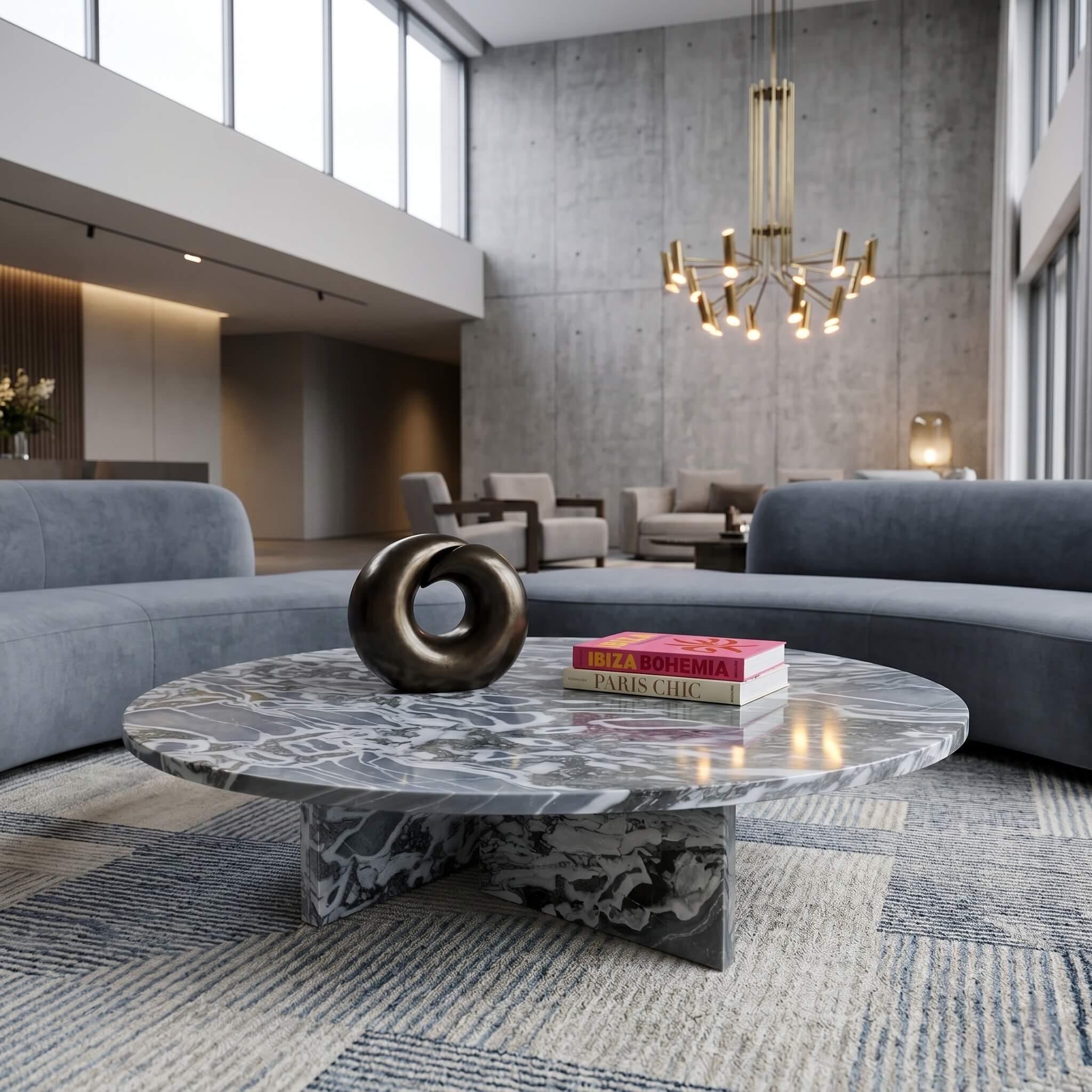 Cloudy blue marble coffee table in a double-height boutique hotel lobby with curved velvet sofas and brass chandelier.