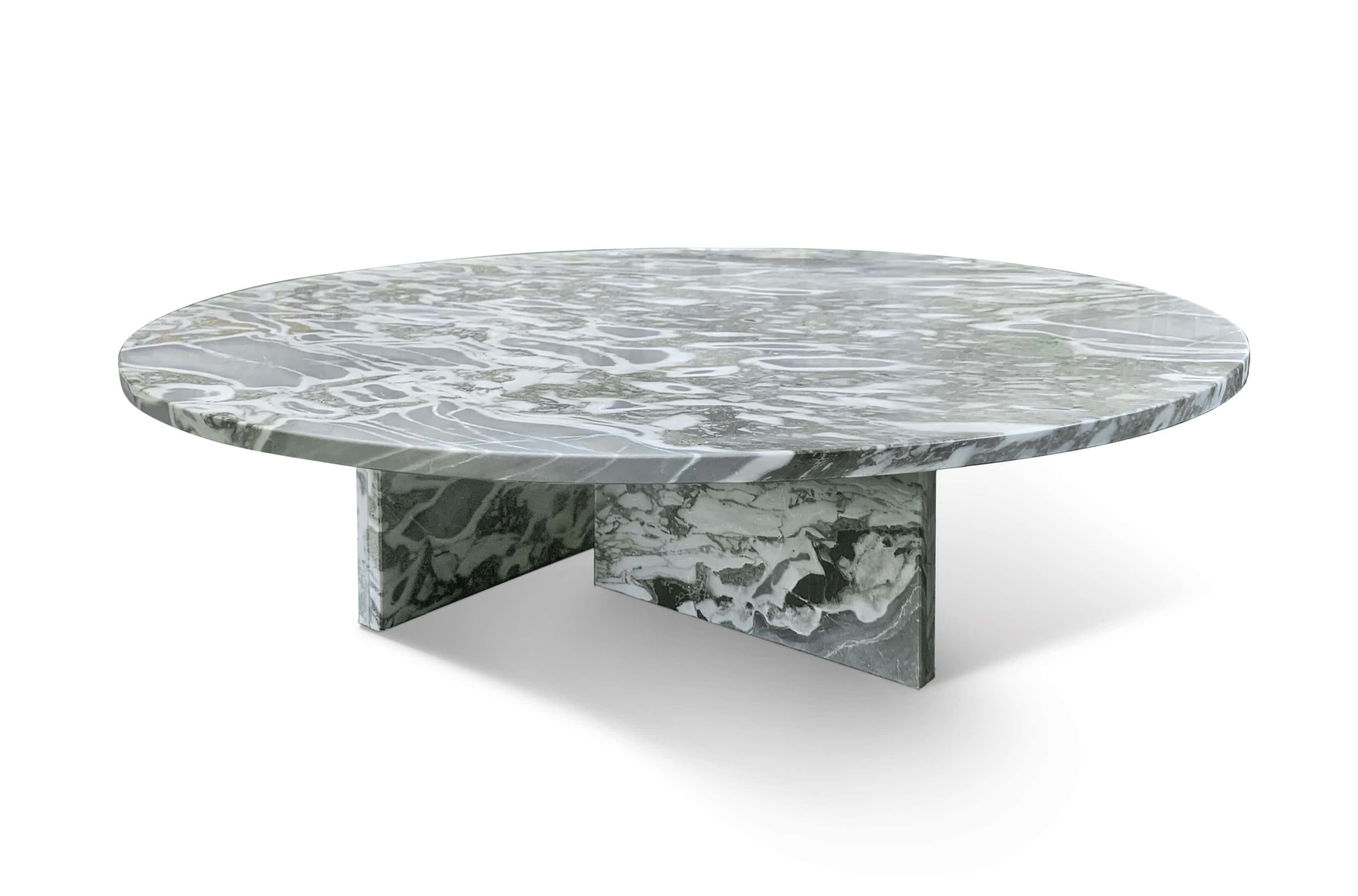 Round cloudy blue marble coffee table with polished finish and T-shaped marble base, 45-degree hero view.