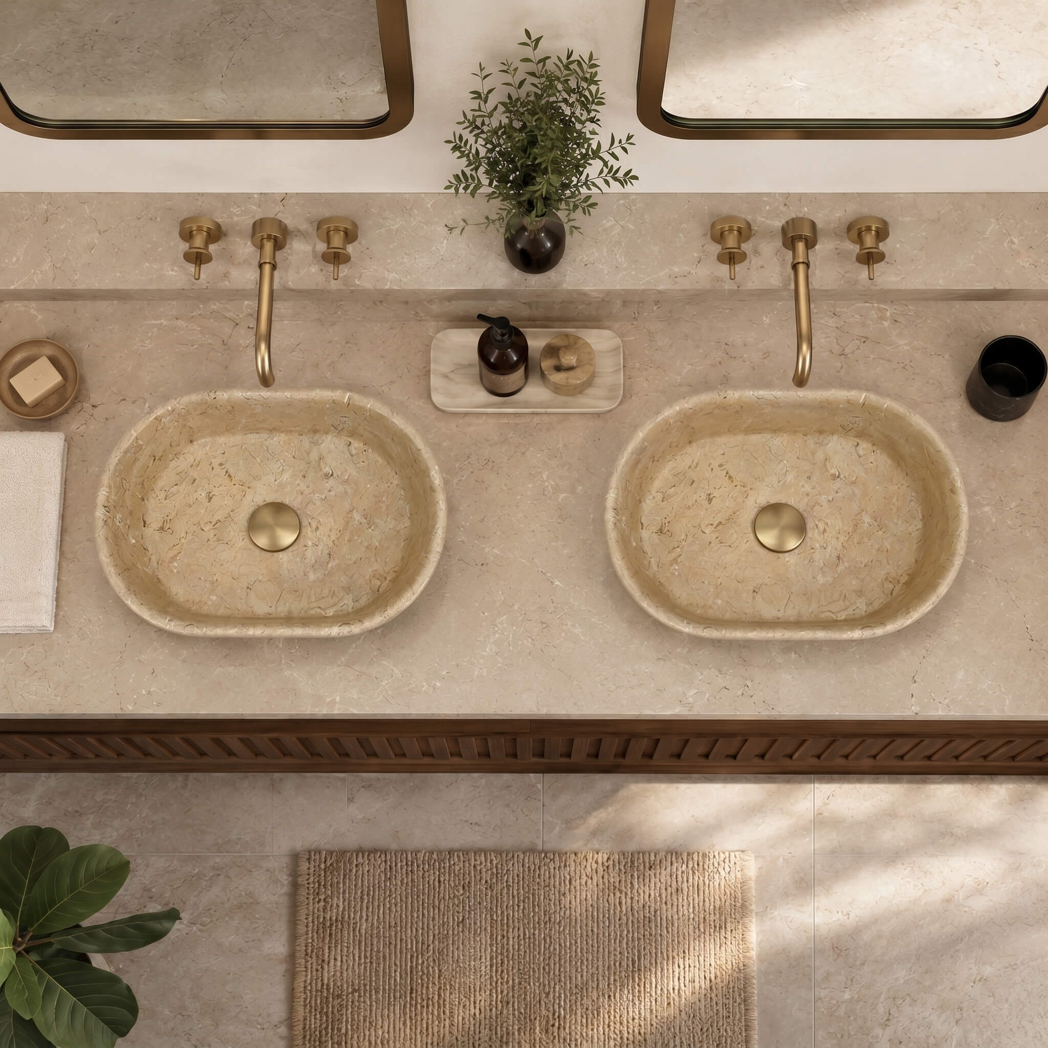 Dual Amber Gold marble vessel sinks on beige marble vanity with brushed brass faucets and botanicals, bathed in natural light, biophilic style.