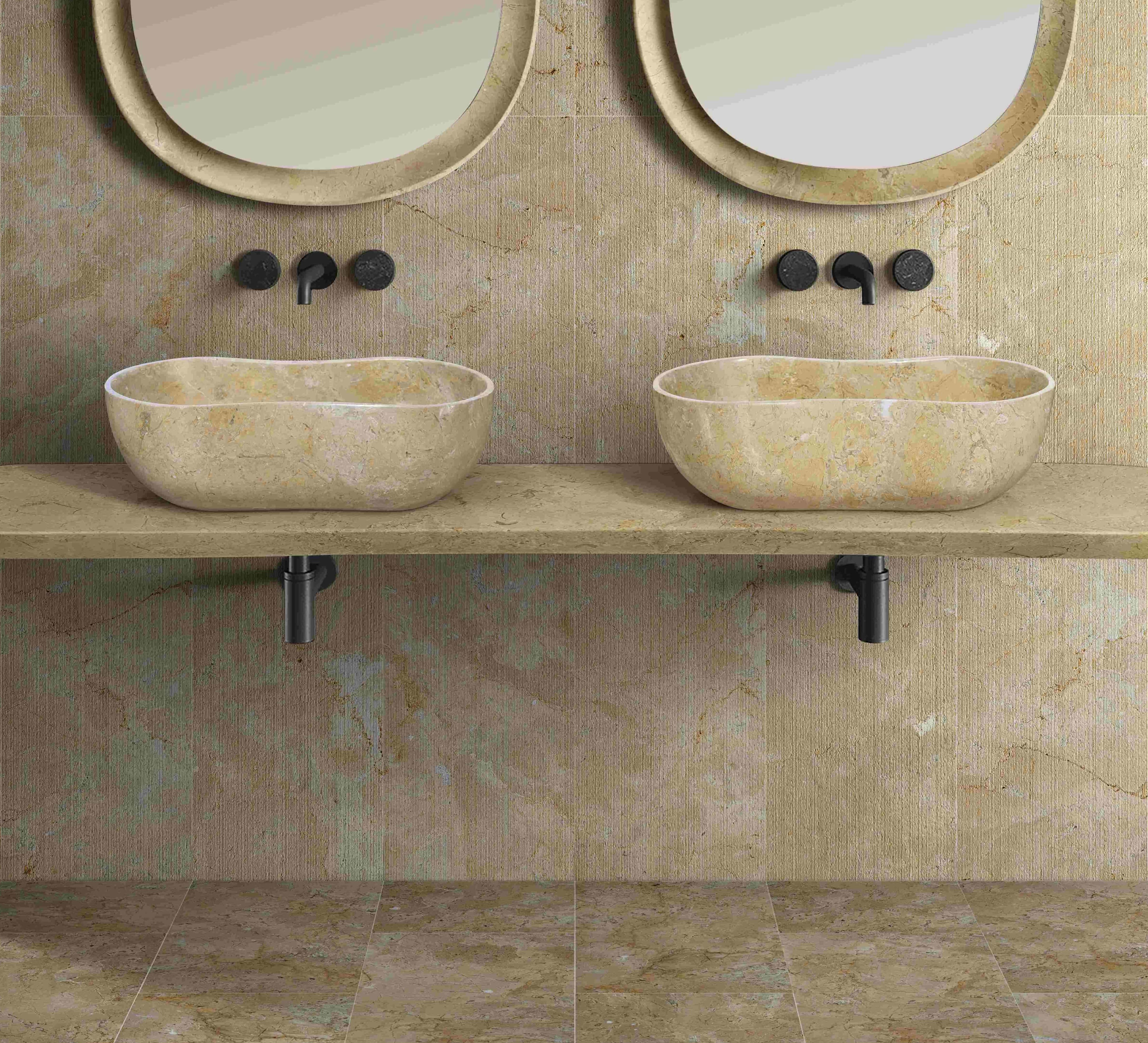 Two Hyatt Gold natural marble Wave vessel sinks with Hyatt Gold textured wall tile and polished Hyatt Gold floor tile, black wall faucets, spa bathroom.