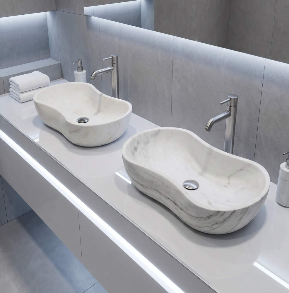 High-angle 3/4 view of a double vanity with twin white wavy marble vessel sinks on a gloss white floating slab counter against light grey vertical-grain microcement wall panels.