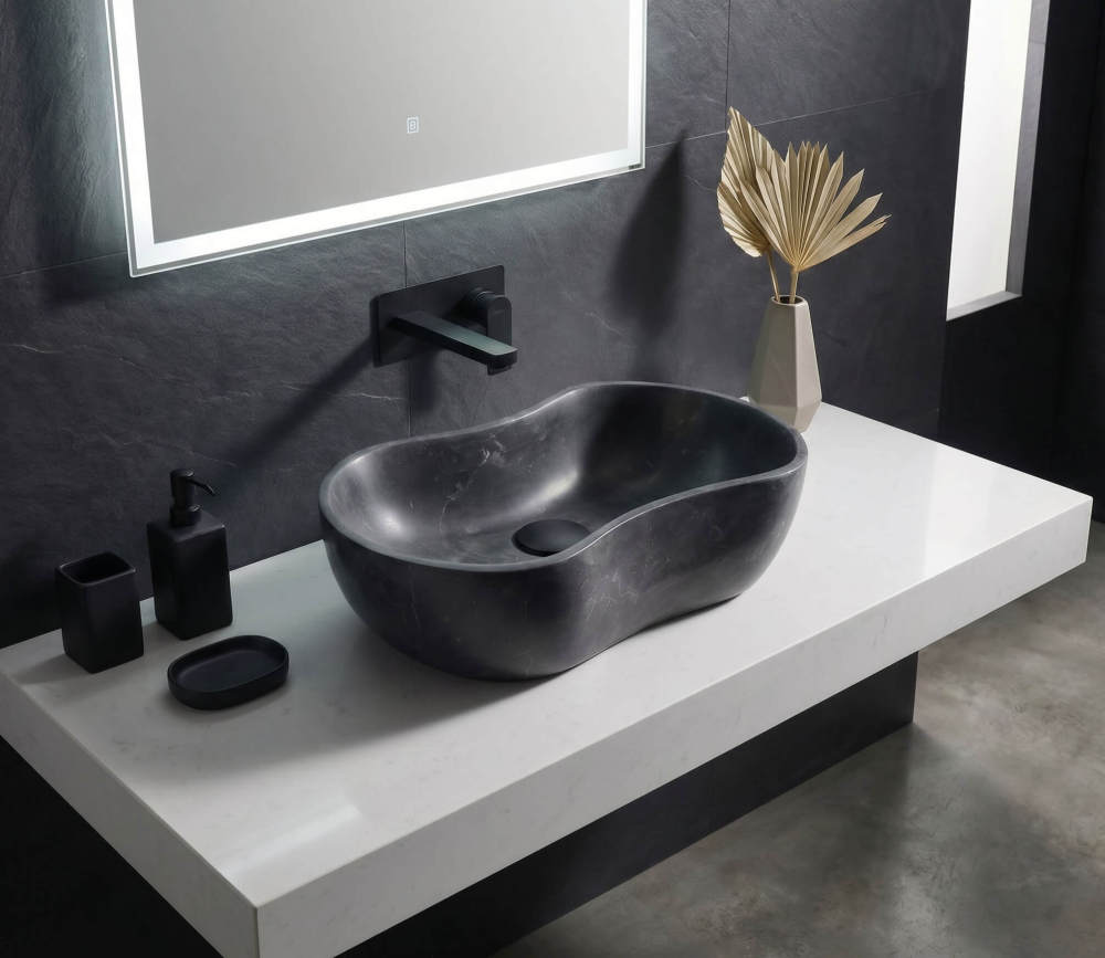 Modern bathroom design showcasing a single Olive Black marble wave vessel sink on a white quartz floating countertop with black matte fixtures.