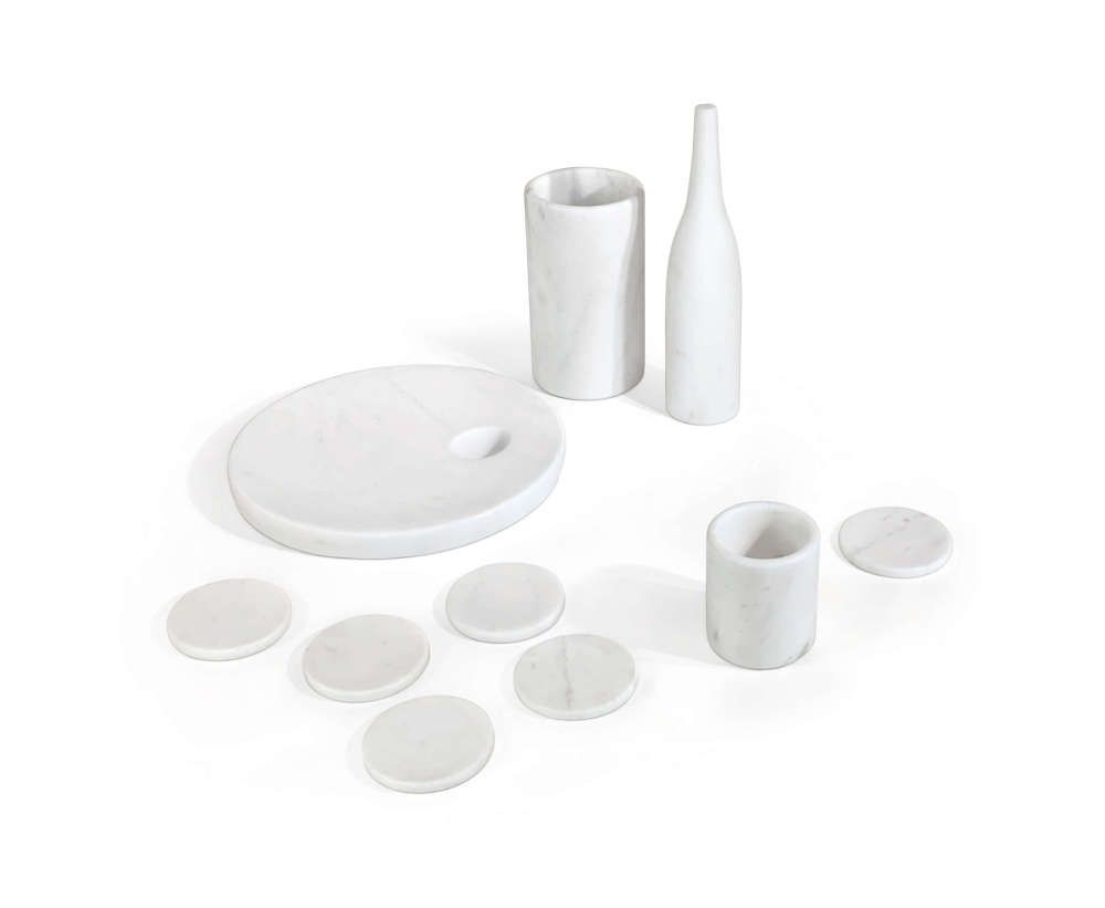 High-angle view of 10-piece Snow Mountain White honed marble home accessories set on white background.