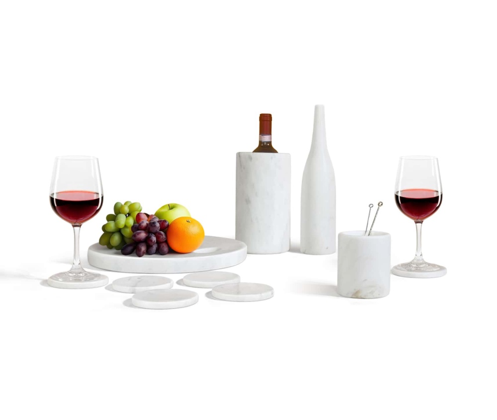 Front view of 10pc Snow Mountain White natural marble accessories set styled with wine and fruit.