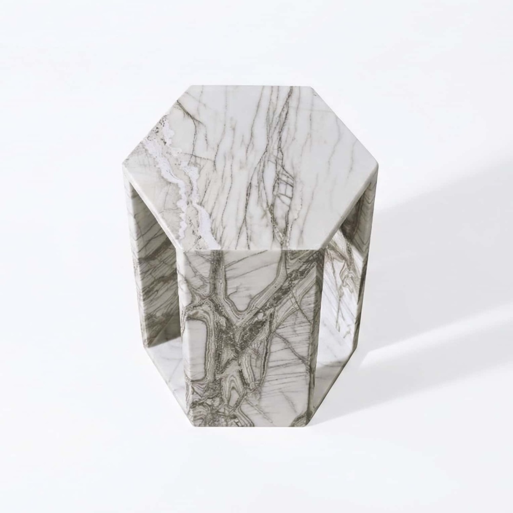 Polished Arboris White marble hexagon side table showing glossy top geometry and soft ambient shadow.