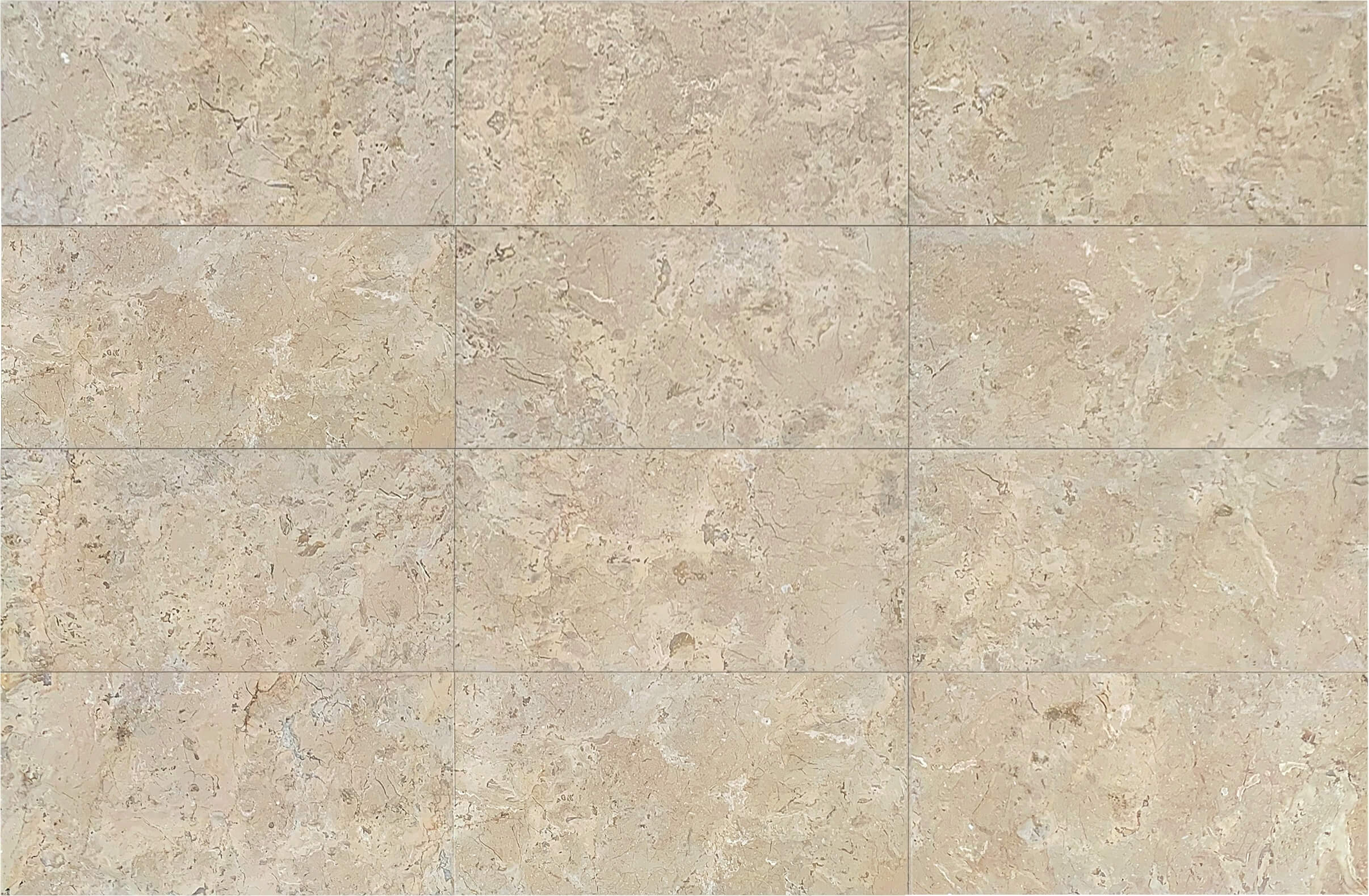 Close-up view of multiple 12x24 Amber Gold honed marble tiles installed, displaying variation in veining and matte texture.