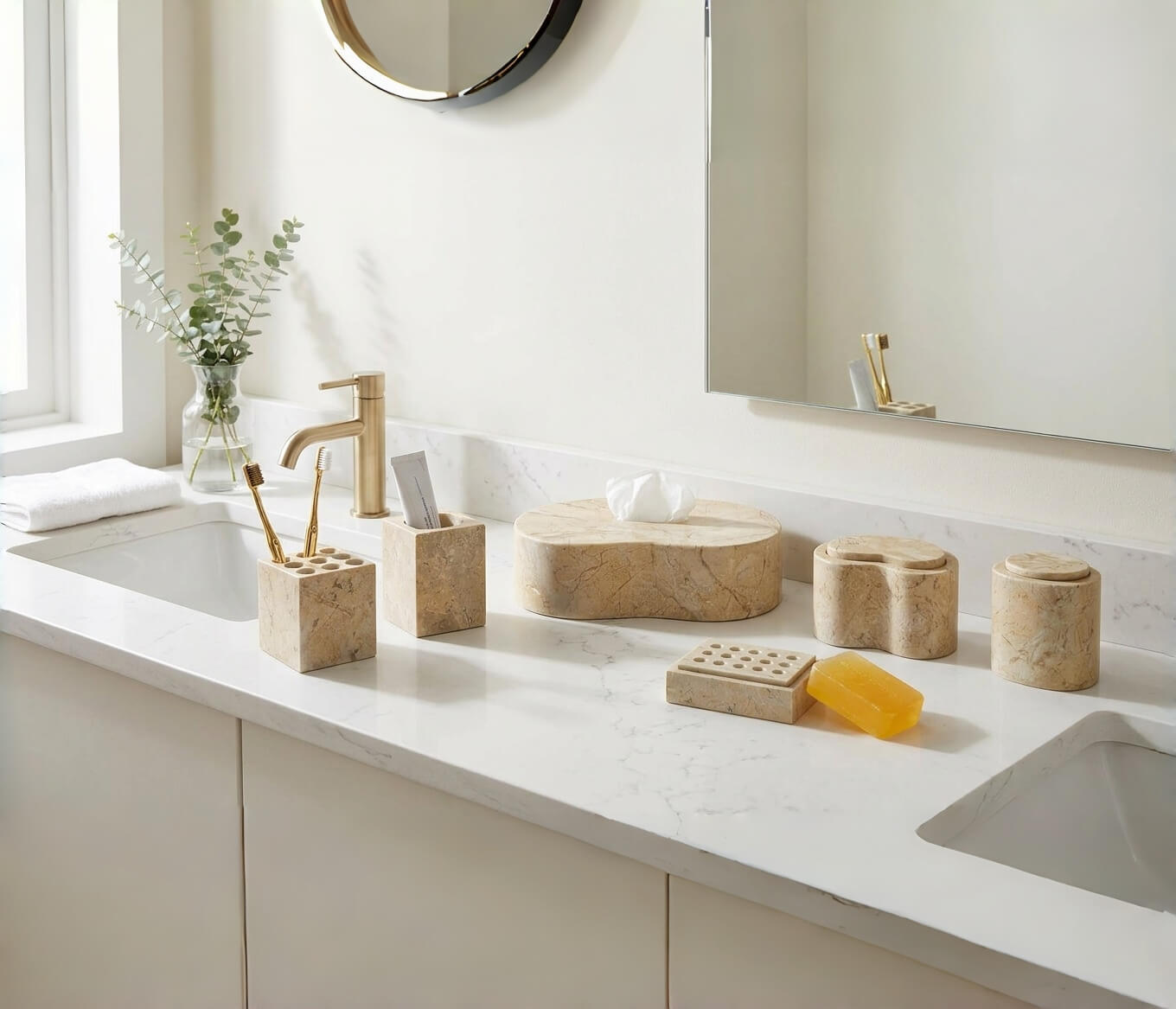 Amber Gold 6-piece natural marble bathroom vanity set arranged on a white stone countertop near a brass faucet.