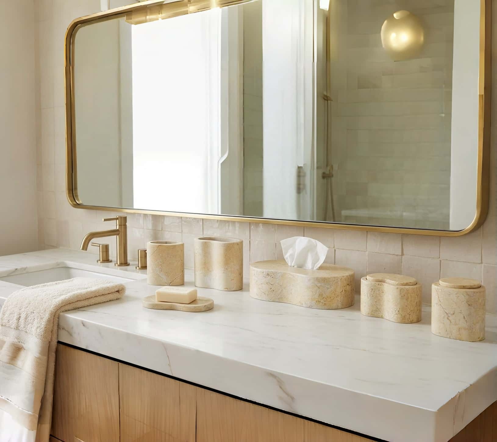 Amber Gold Wave natural marble 6-piece bathroom vanity set styled on a white countertop with brushed brass fixtures.