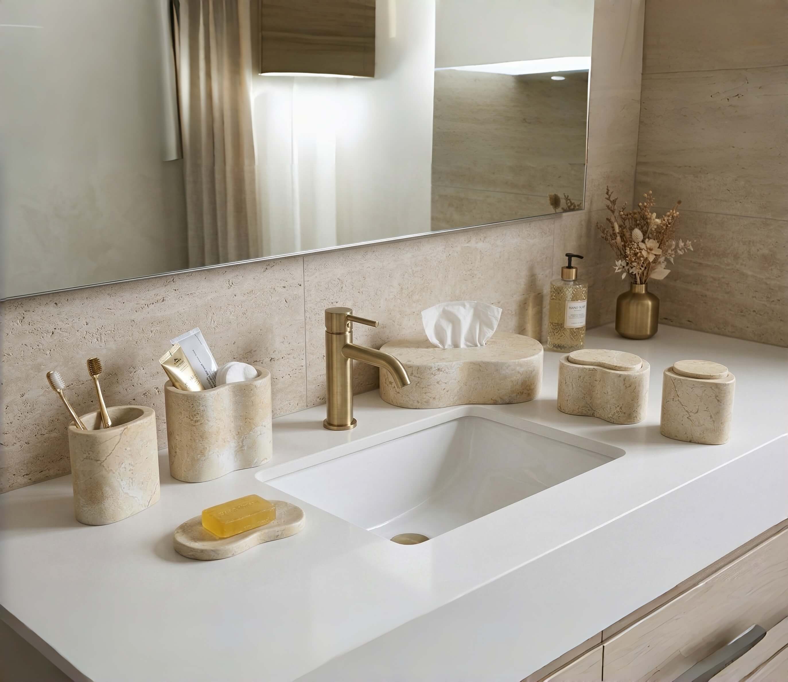 Amber Gold Wave natural marble 6-piece accessory set complementing warm beige travertine bathroom walls and gold accents.