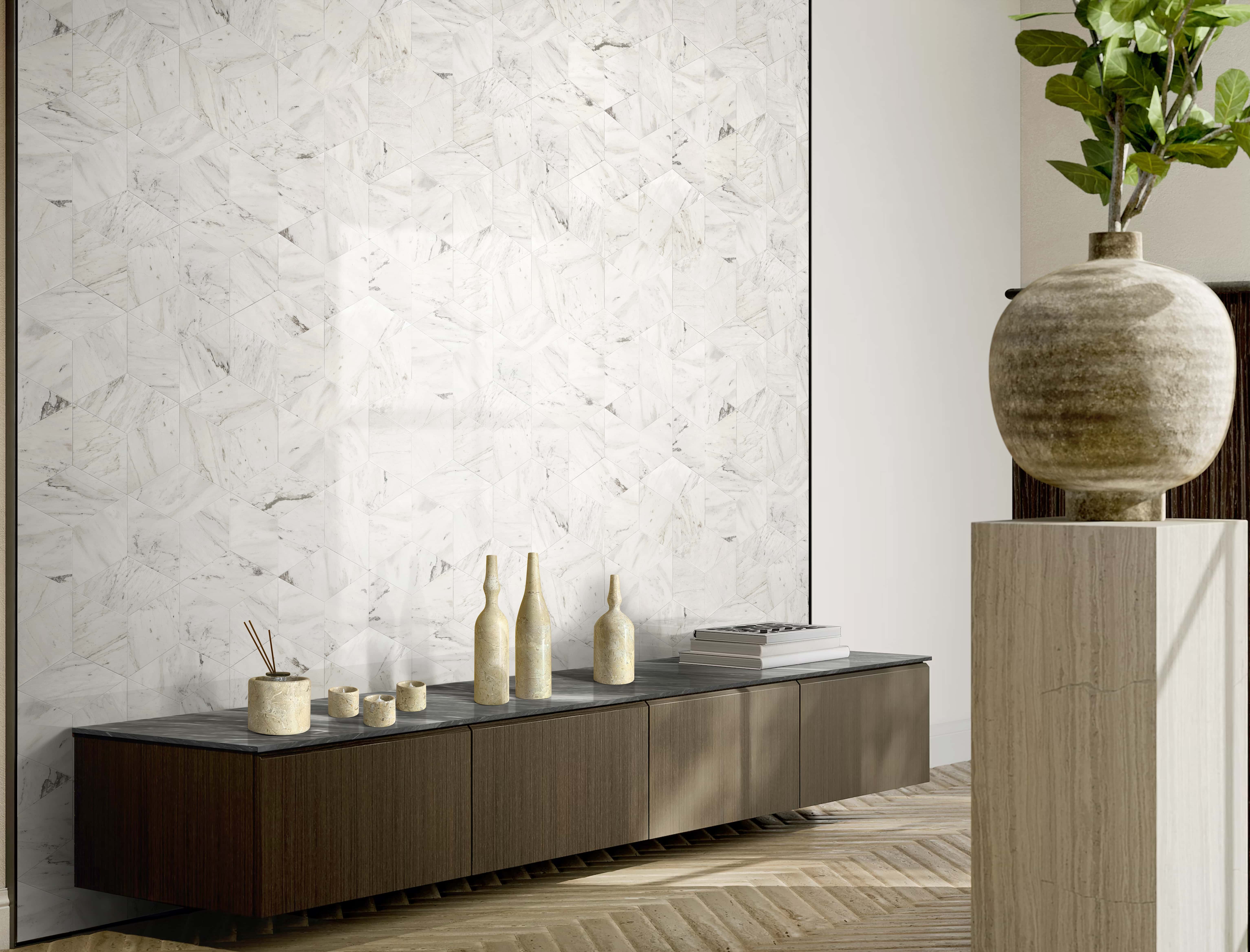 Seven-piece Amber Gold marble decor set on a dark console styled against a Snow Mountain White hexagon tile wall.