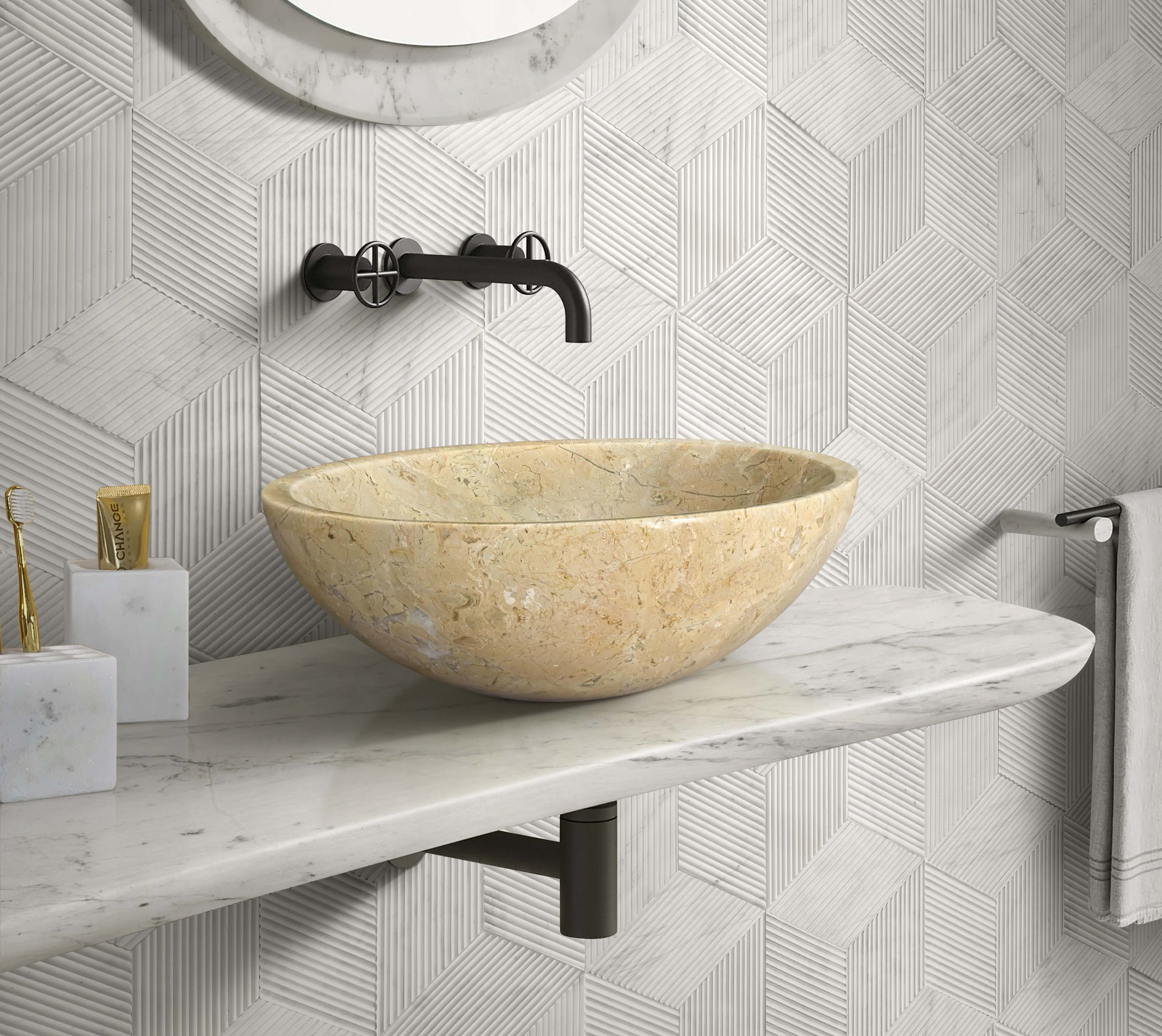 Amber Gold marble vessel sink with Snow Mountain White hexagon textured wall tile and matching honed marble accessories set.
