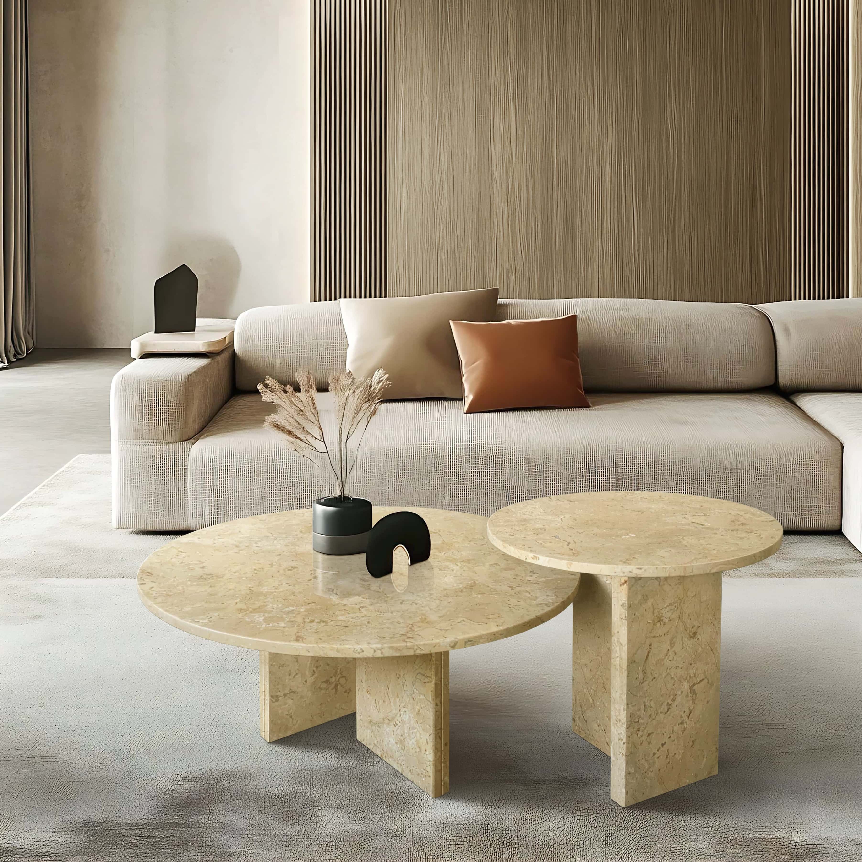 Amber Gold marble nesting coffee tables styled in a modern living room with fluted wall panels and beige seating.
