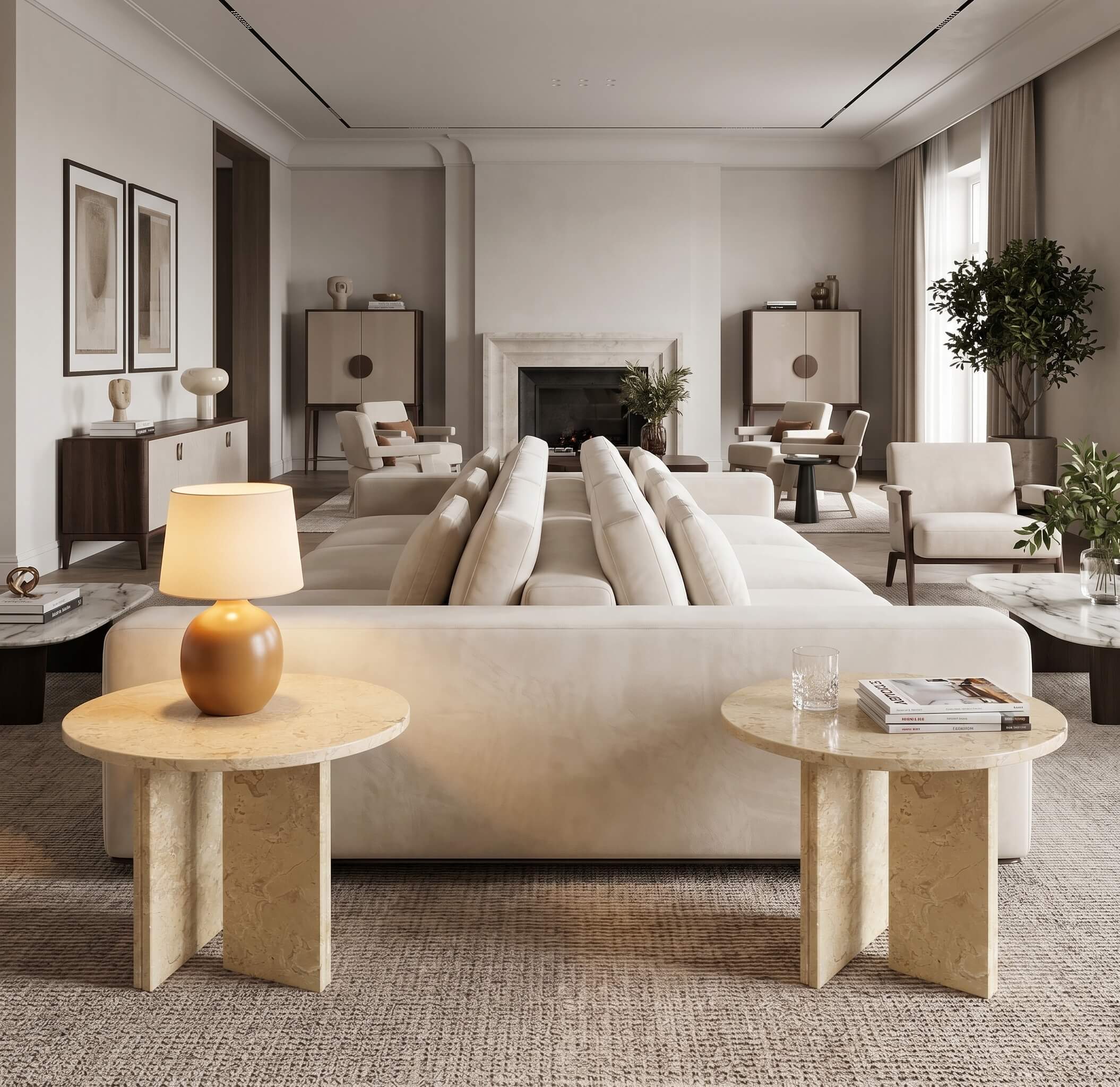 Pair of Amber Gold 45cm marble side tables arranged behind a modular cream sofa in a modern open-plan room.