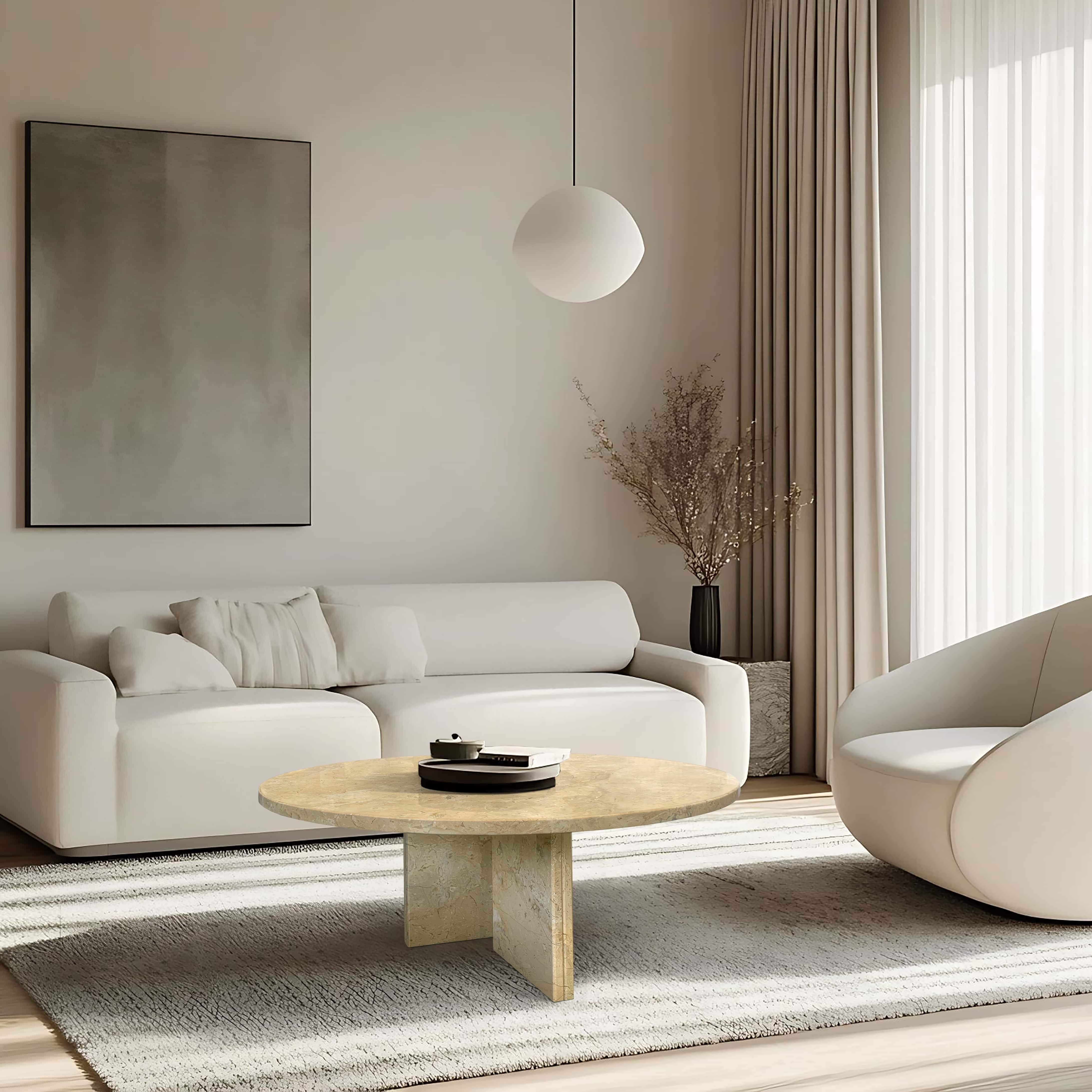 Sunlit living room featuring Amber Gold natural marble round coffee table with 70cm top beside sleek white sofa.