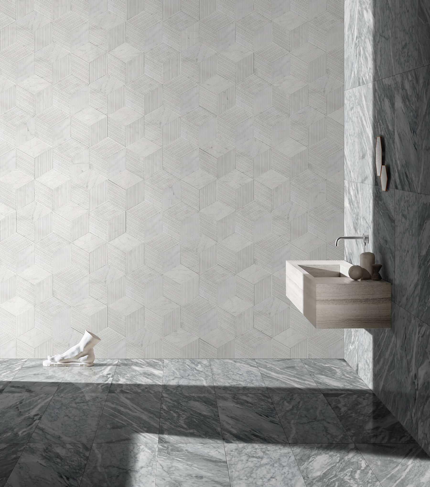 Contemporary bath with 12x24 Carrara Gray polished floor and wall tiles paired with white hexagon textured accent wall.