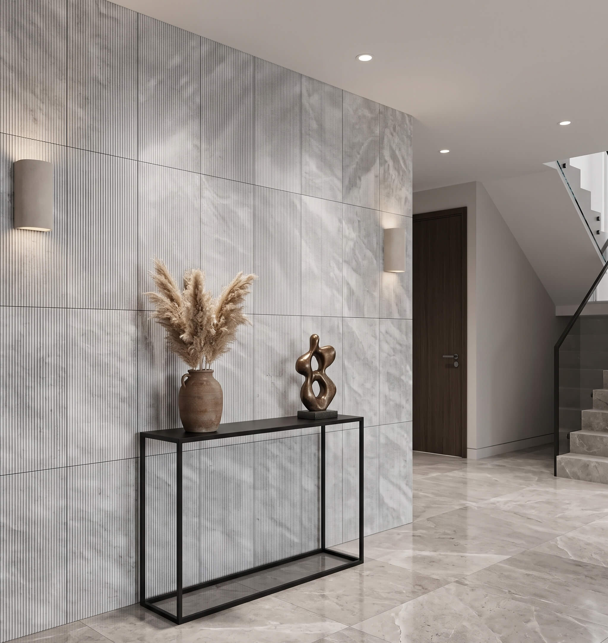 Modern entryway featuring a console table set against a 12x24 fluted Carrara gray marble tile feature wall.