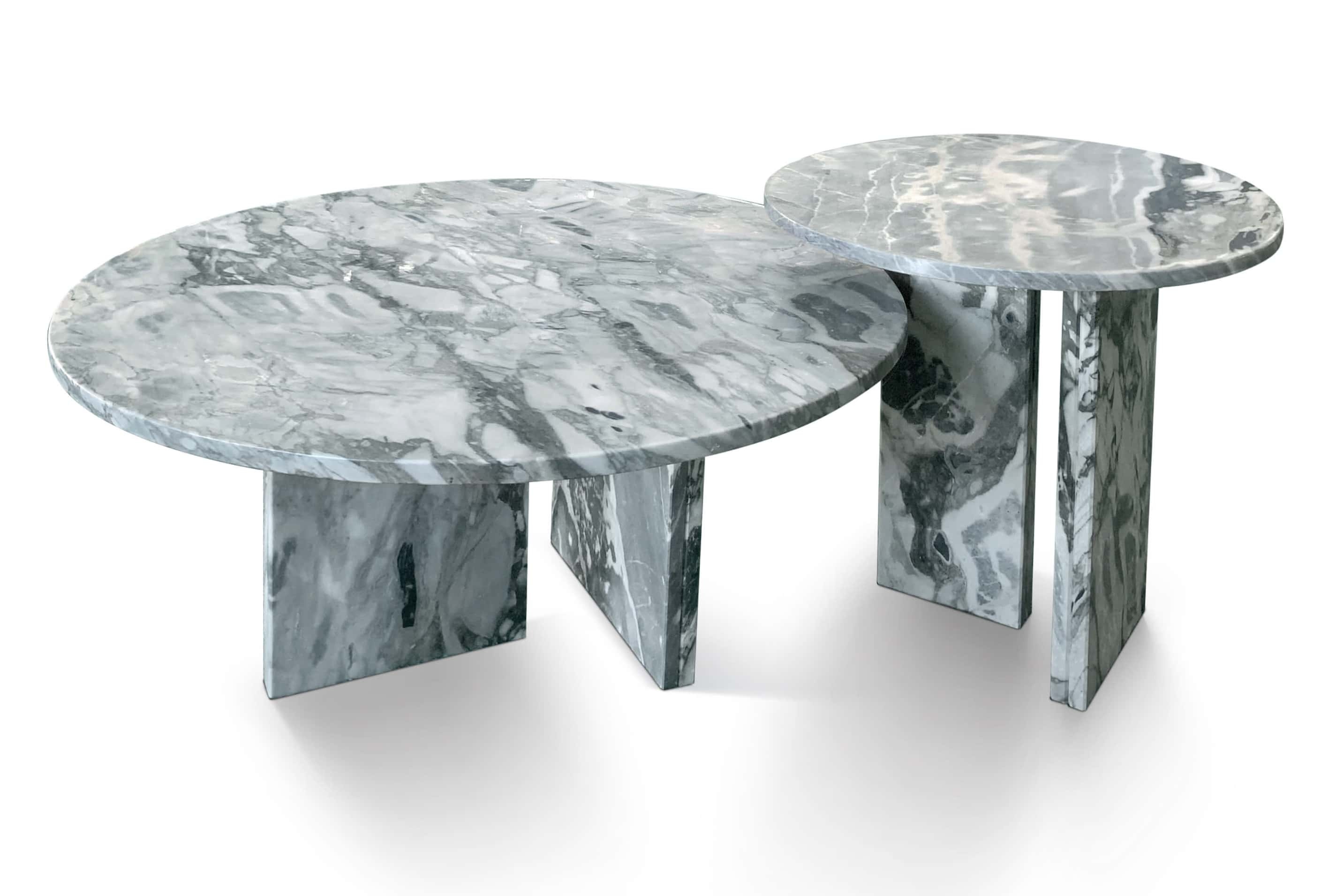 Two-piece round cloudy blue natural marble nesting coffee table set featuring polished upright bases and distinct veining.