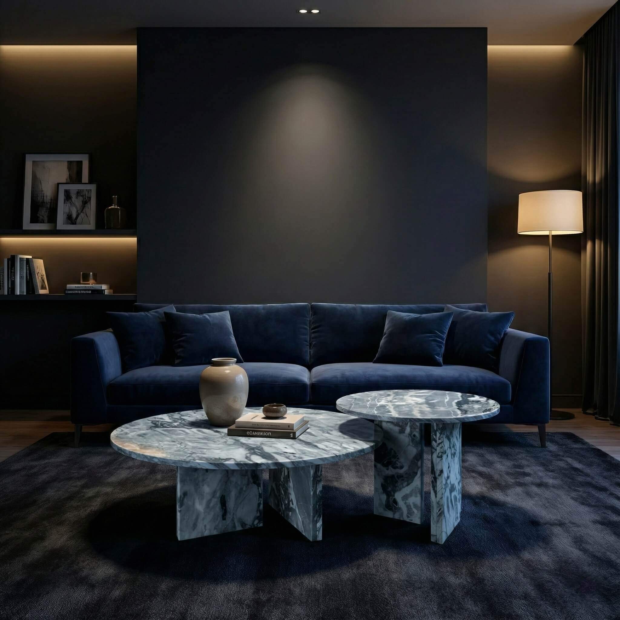 Round blue marble center table set featuring polished upright bases positioned in a luxury dark lounge with a navy blue sofa.