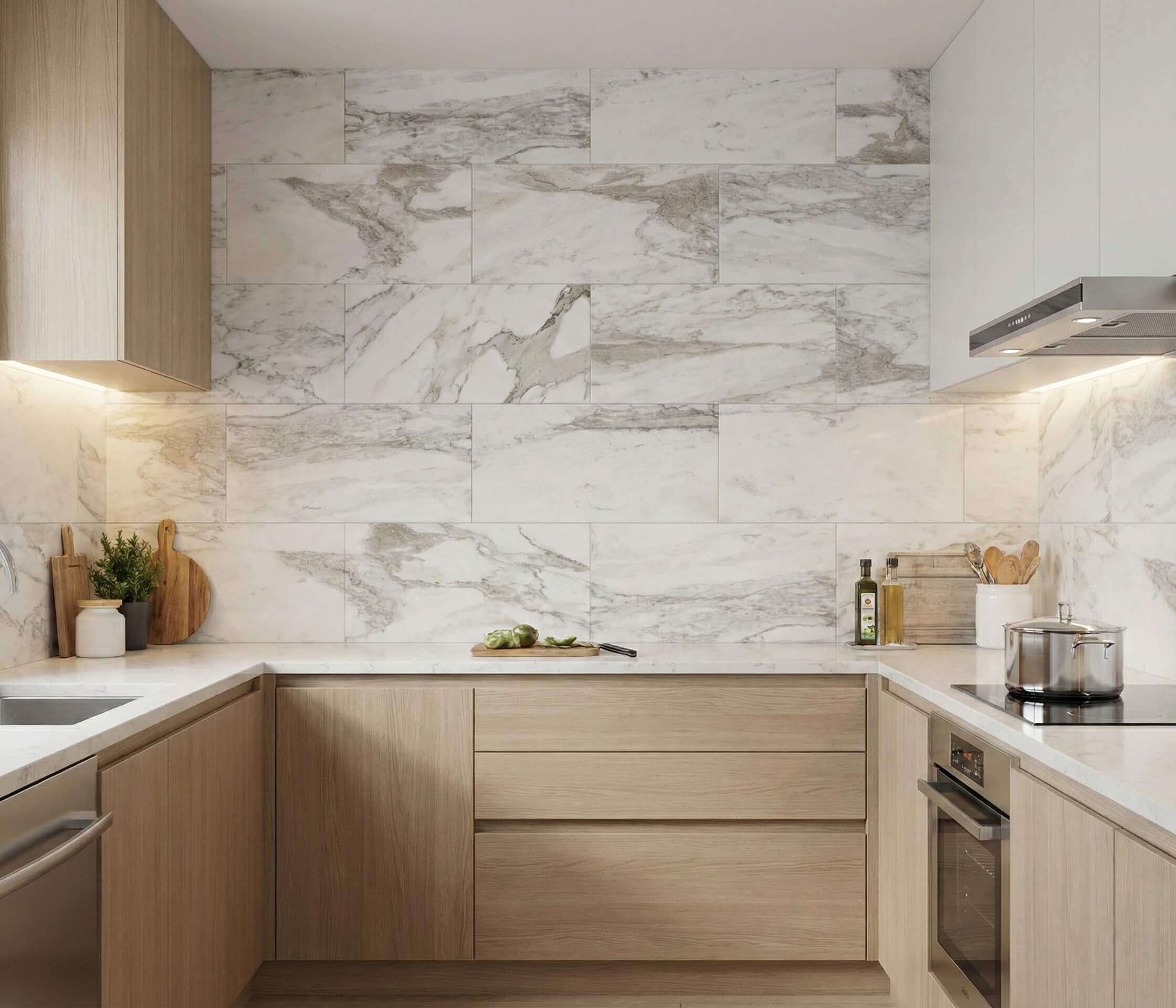 Modern kitchen interior showcasing 12x24 polished Snow Mountain white marble tiles installed as an elegant backsplash.