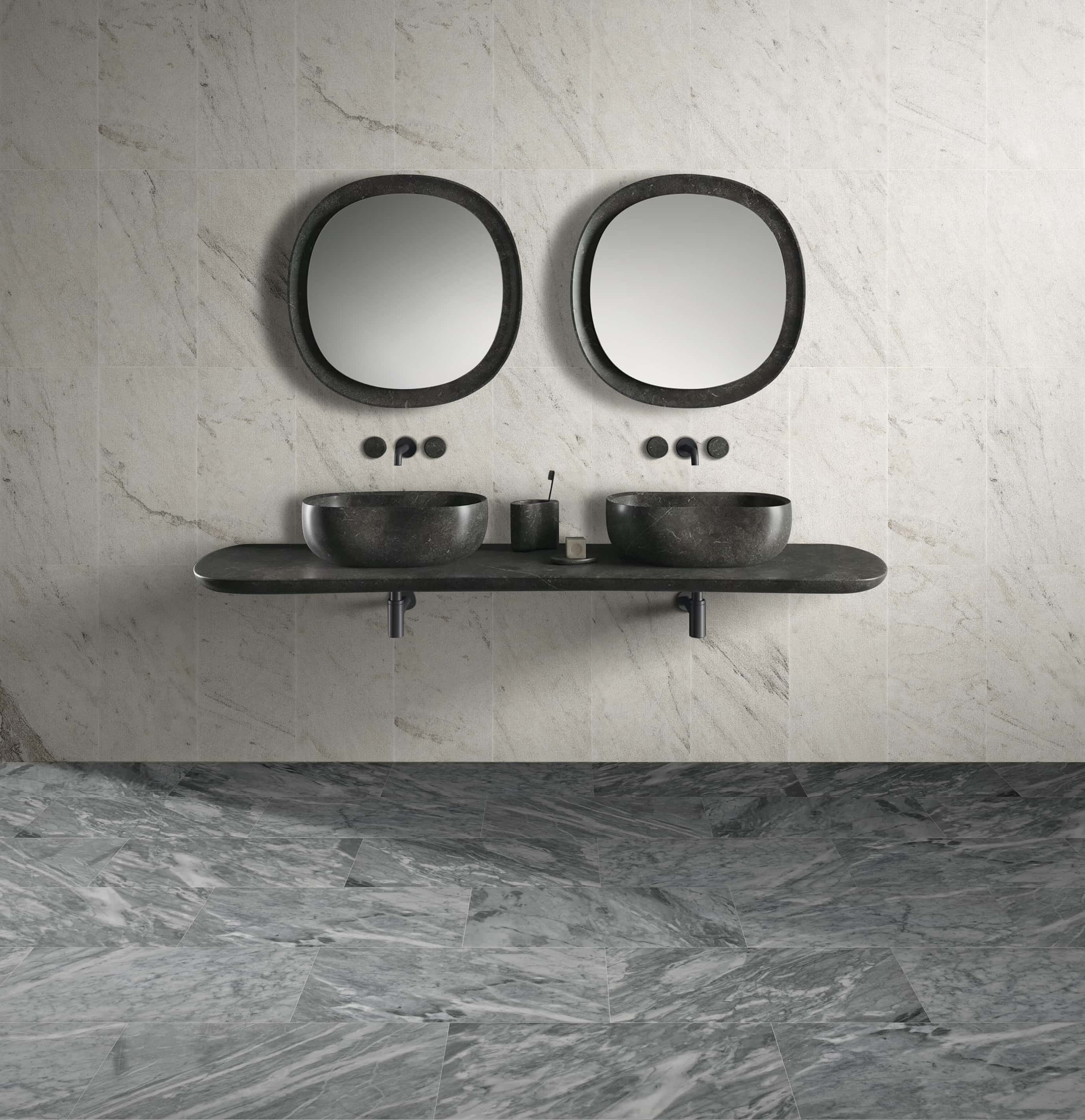 Bathroom mixing Snow Mountain White FS textured wall tiles, Carrara Gray floors, and Olive Black wave vessel sinks.