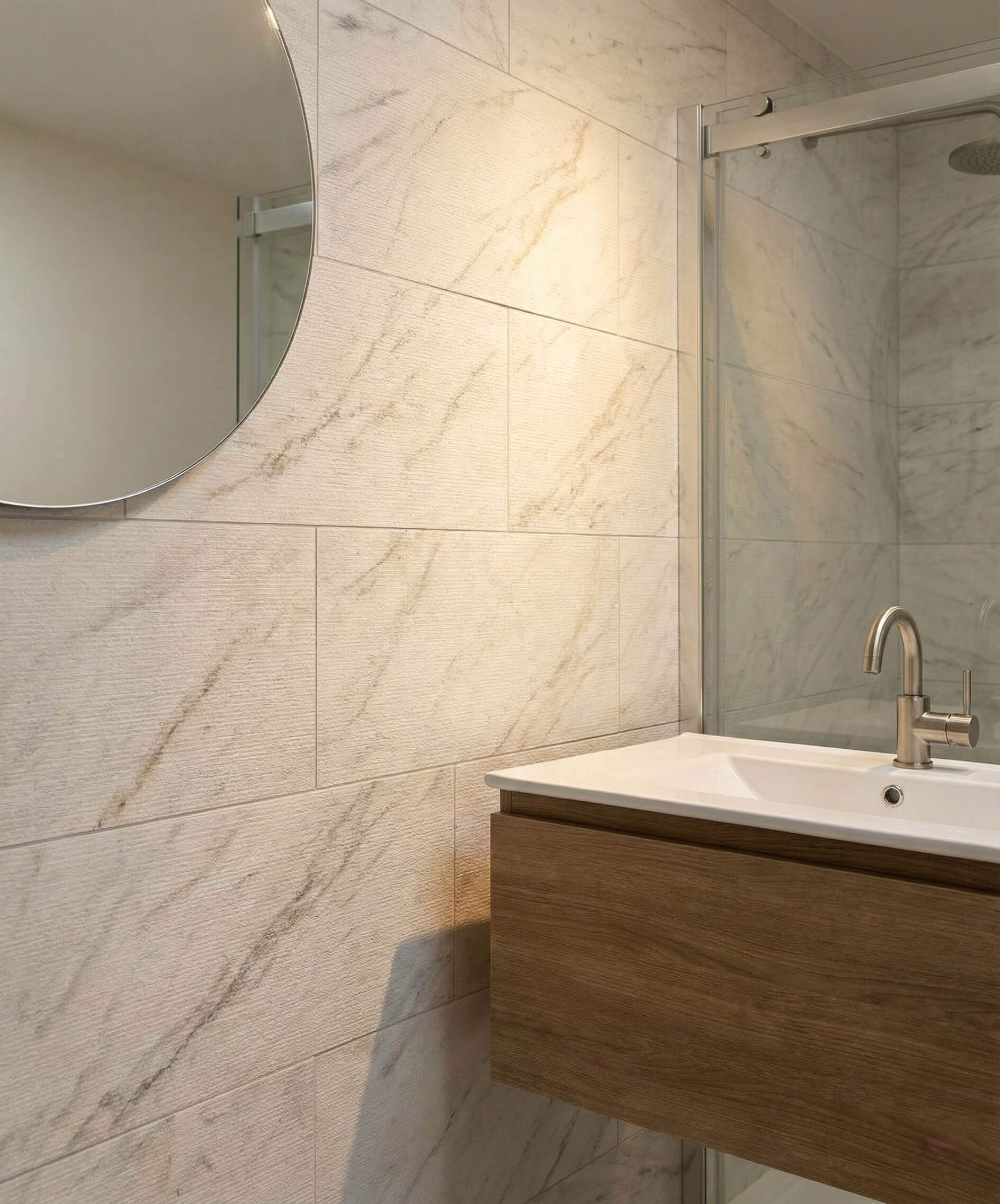 Close-up of a luxury bathroom wall featuring Snow Mountain White FS textured marble tiles with fine grooved natural veining.
