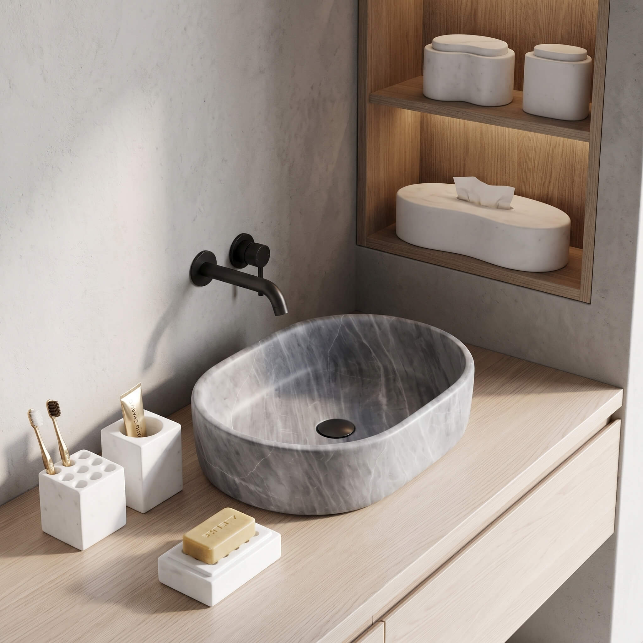 Honed Snow Mountain White marble Square Style set styled alongside a Carrara Gray honed oval vessel sink on an oak vanity.