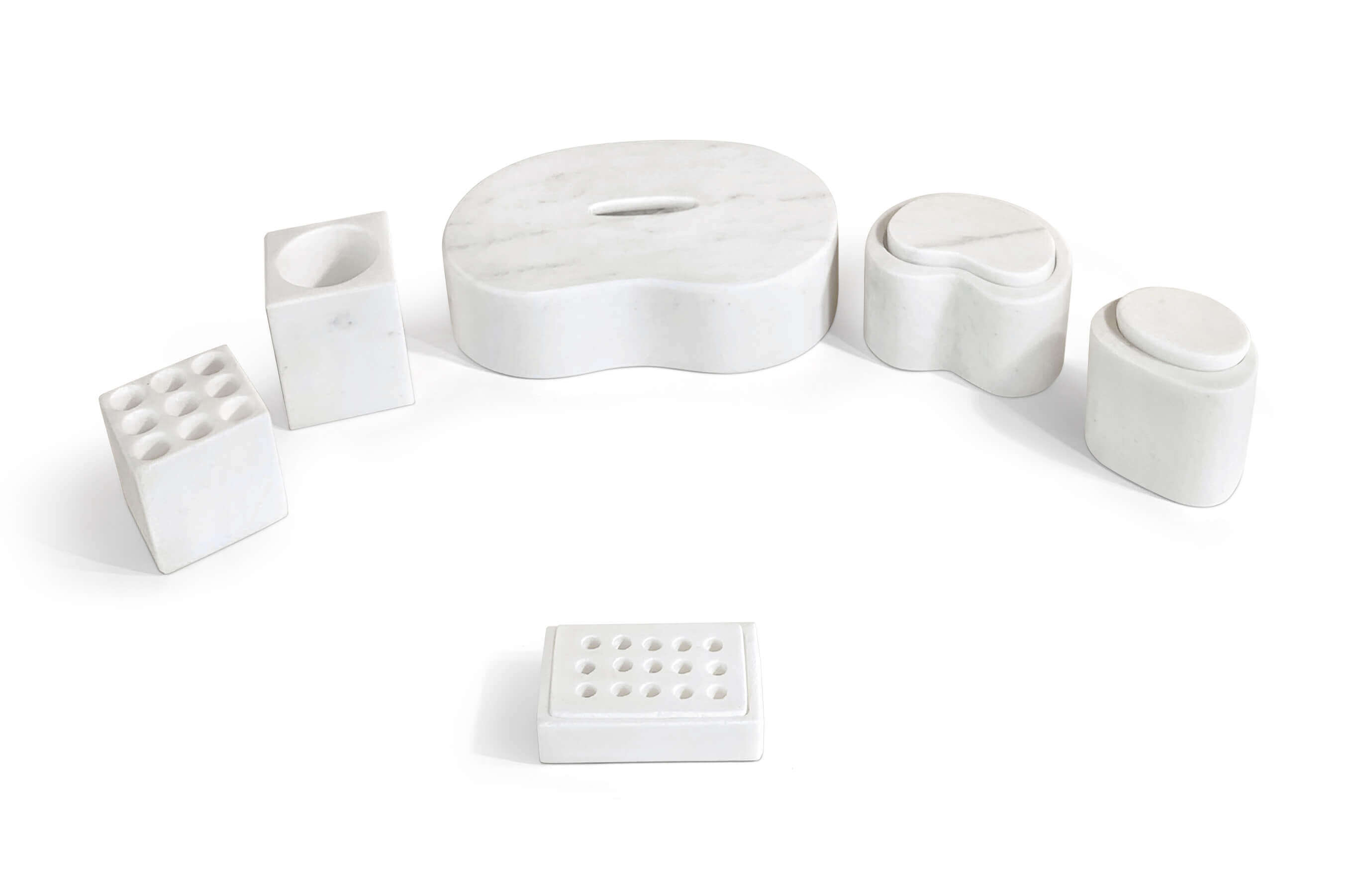 Elevated view of honed Snow Mountain White marble bathroom set in Square Style showing 9-slot toothbrush holder and jars.