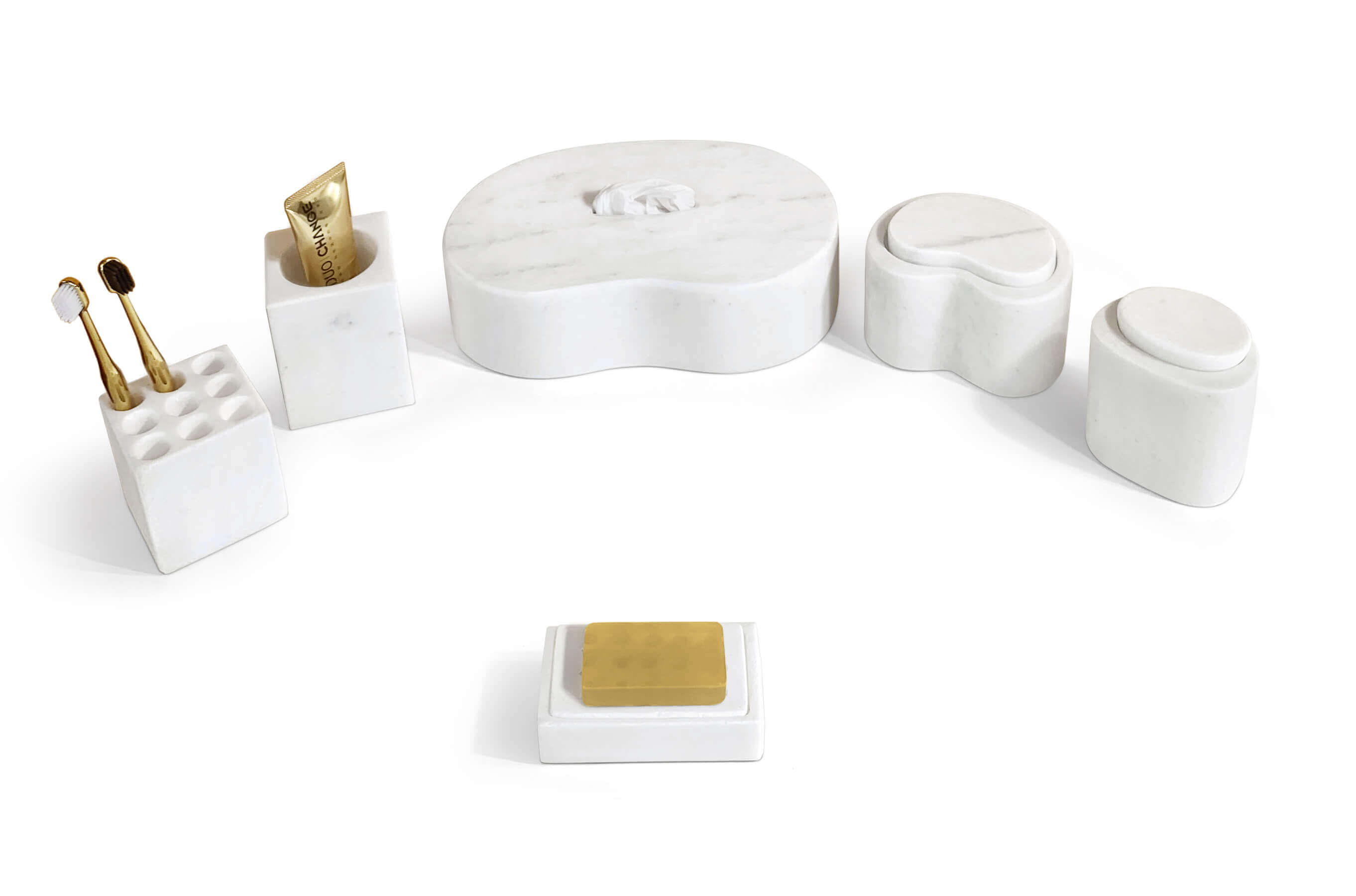 Angled view of Snow Mountain White stone bathroom accessories set in Square Style in use with toothpaste tube and soap.