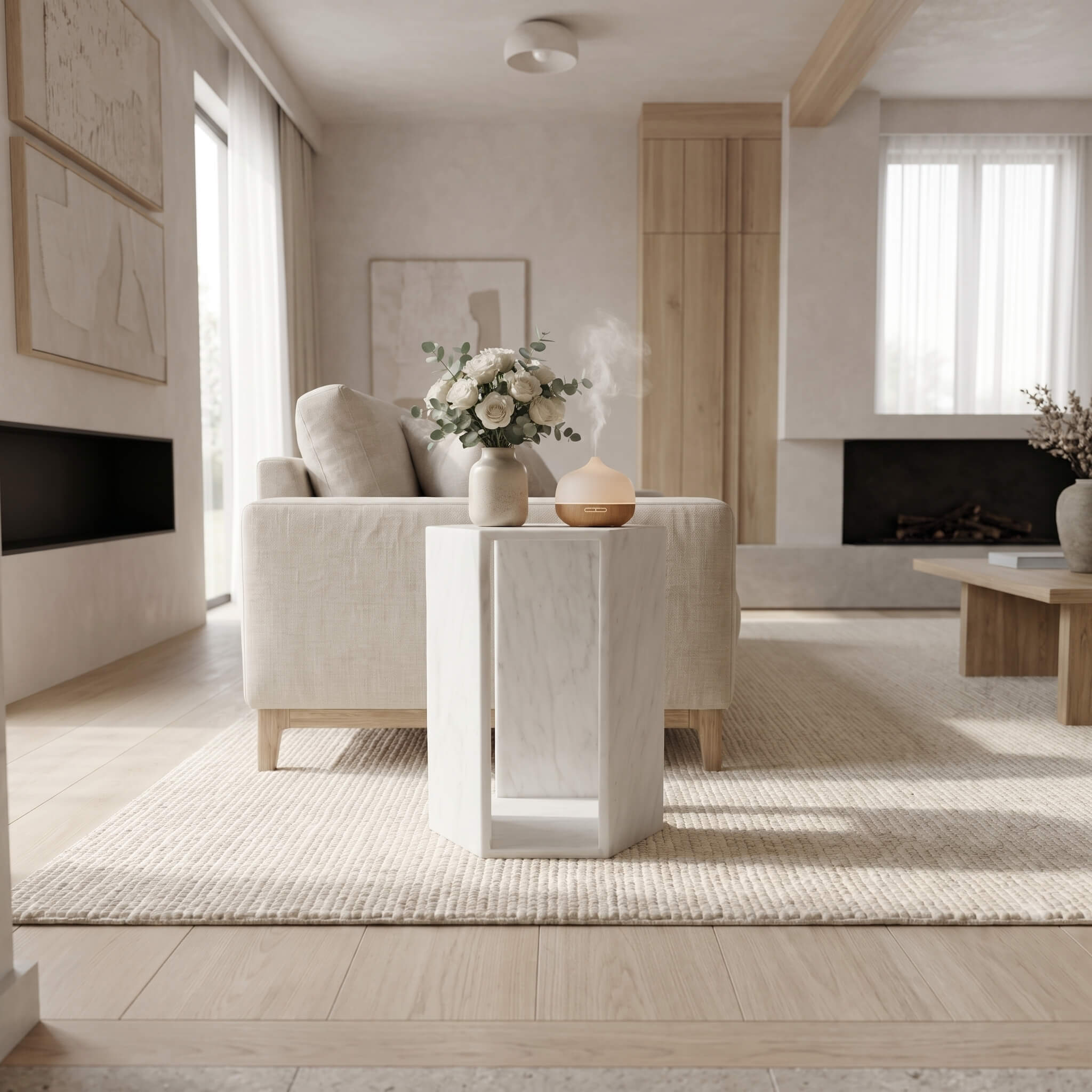 Honed Snow Mountain White marble hexagon side table used in a bright modern living room, styled with a diffuser and vase.
