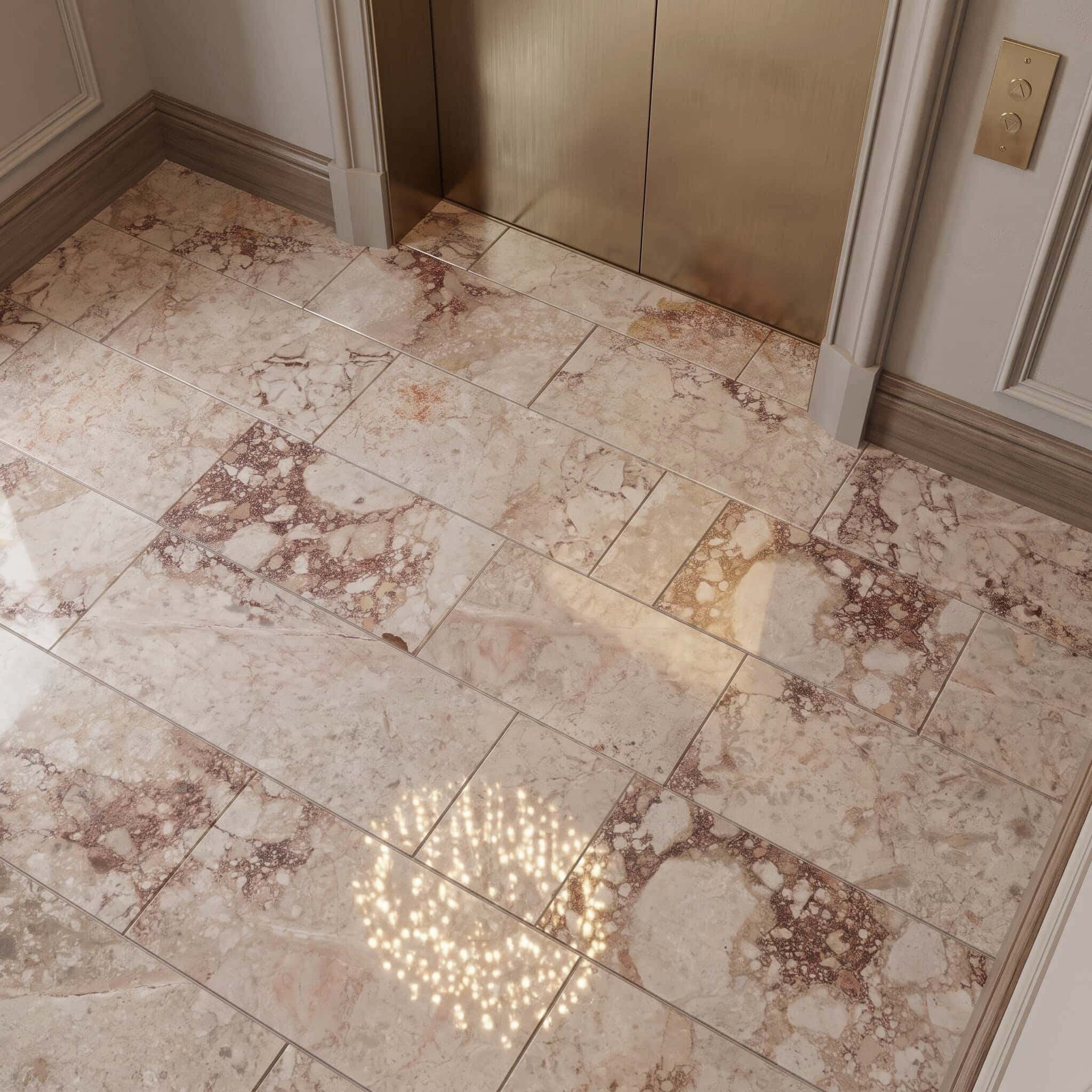 Staggered 12x24 Diamond Pink real marble tile floor with polished breche marble veining by brushed brass elevator doors.