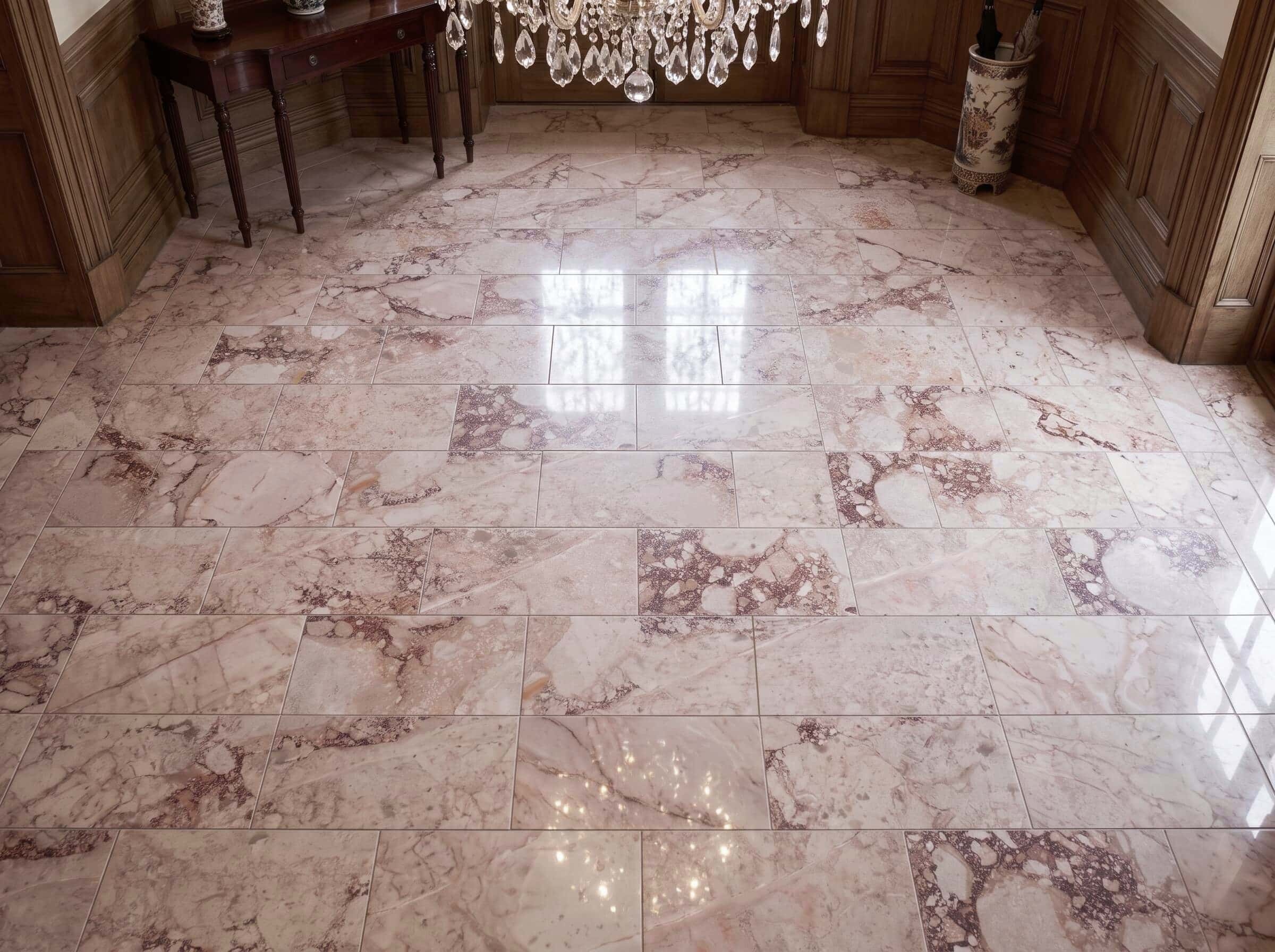 Polished 12x24 Diamond Pink marble floor tile with breccia rose marble veins in a grand wood-paneled entryway.