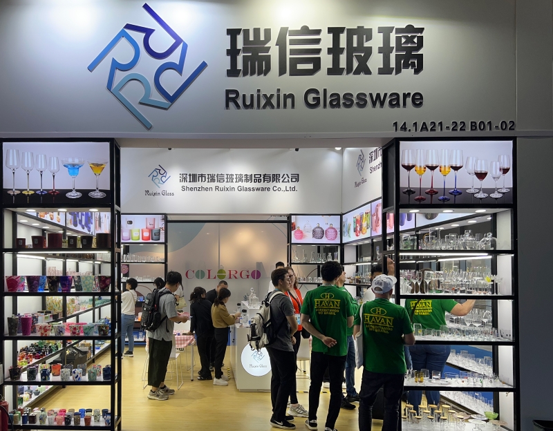 Company exhibition booth with glassware display