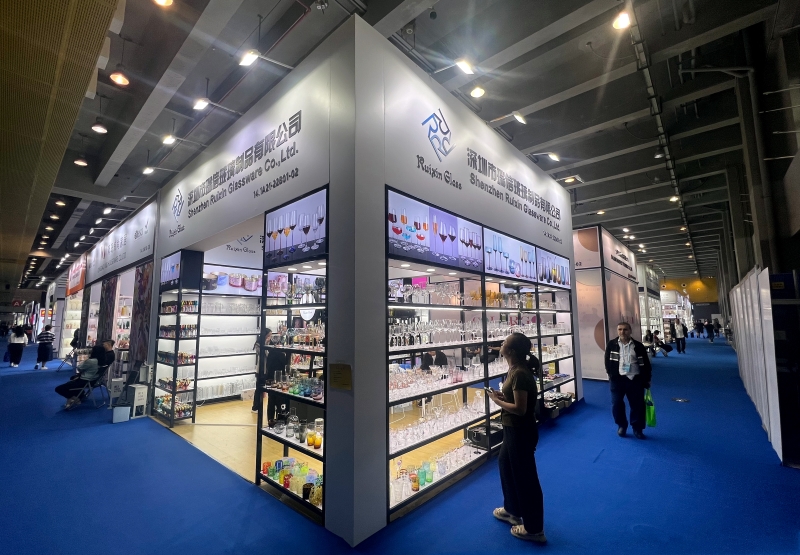 Potential clients inspecting products at the company booth