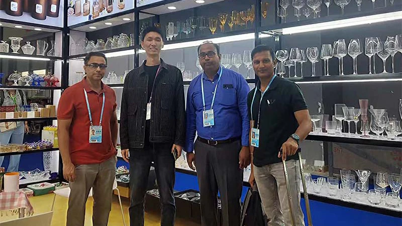 Colorful glassware collection on display at trade show