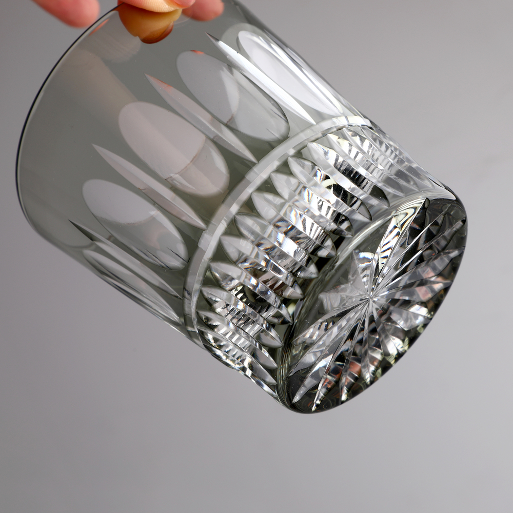 Master artisan hand cutting glass