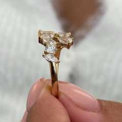 Macro side profile of a lab diamond ring showing the secure prong setting and 14k gold metalwork, reflecting the precision quality of an 18-year jewelry manufacturer.