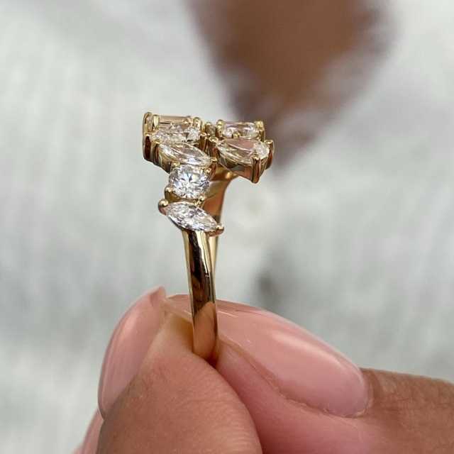 Macro side profile of a lab diamond ring showing the secure prong setting and 14k gold metalwork, reflecting the precision quality of an 18-year jewelry manufacturer.