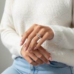 Lifestyle photography of a model wearing a trendy mixed shape diamond open ring paired with a cozy white sweater, perfect for modern bridal or anniversary gifting.