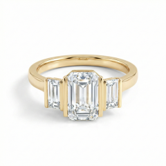Close-up face-up view of a 1.5 carat emerald cut lab diamond, revealing the concentric rectangular step-cut facets and the hall-of-mirrors optical effect. IGI Certified E Color.