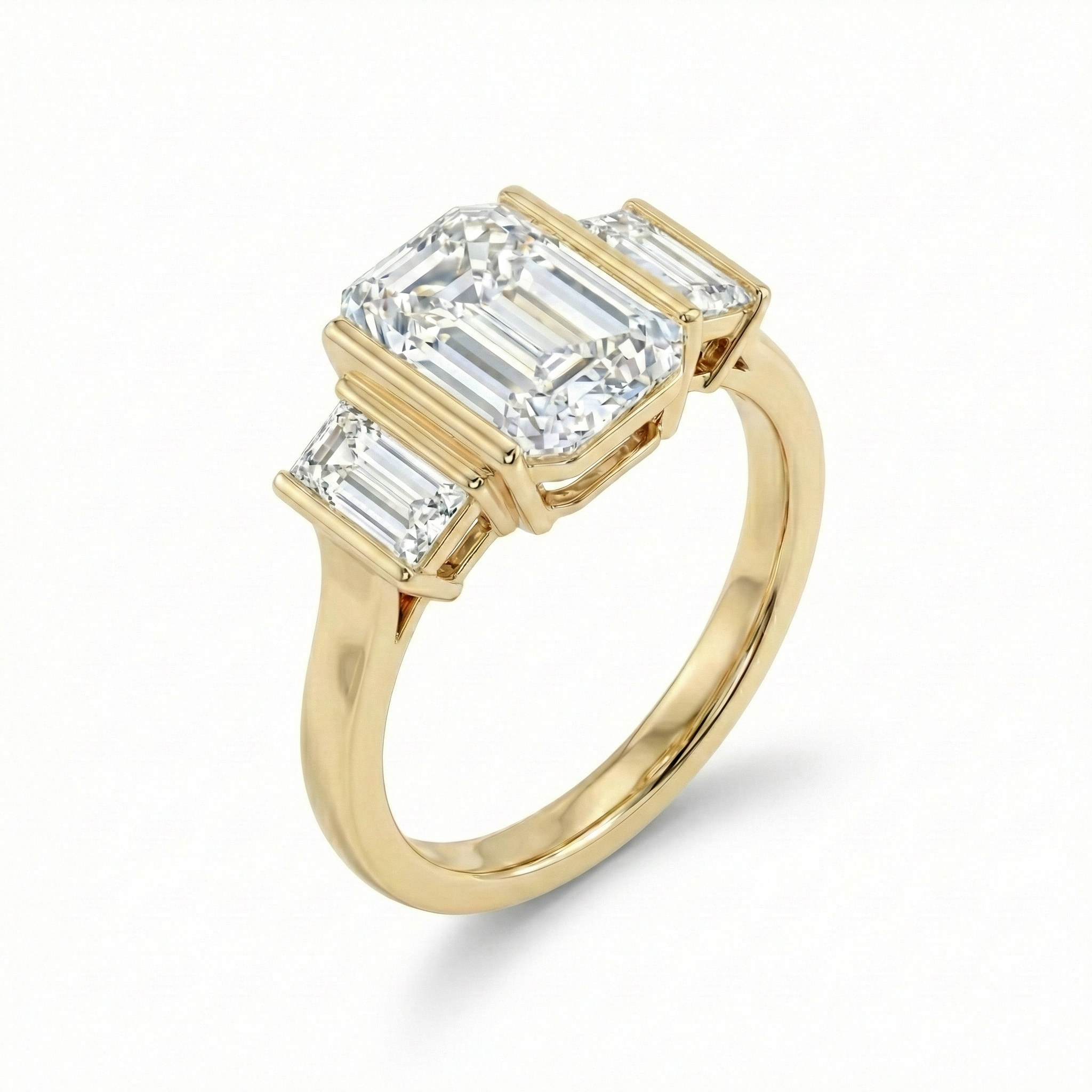 Detailed angled shot focusing on the polished 14k yellow gold shank and the seamless transition to the baguette side stones of this lab grown diamond ring.