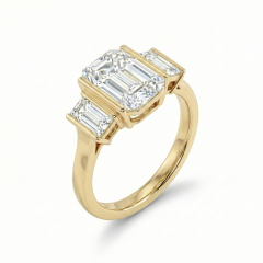 Detailed angled shot focusing on the polished 14k yellow gold shank and the seamless transition to the baguette side stones of this lab grown diamond ring.