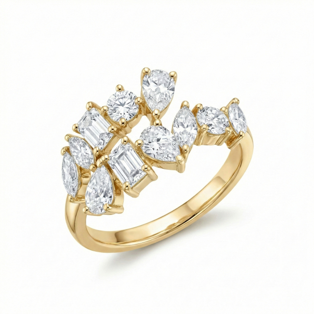 A front view of a 14k yellow gold open cuff ring featuring a cluster of emerald, pear, marquise, and round cut lab-grown diamonds (E-F color, VS clarity), handcrafted by an 18-year source factory.