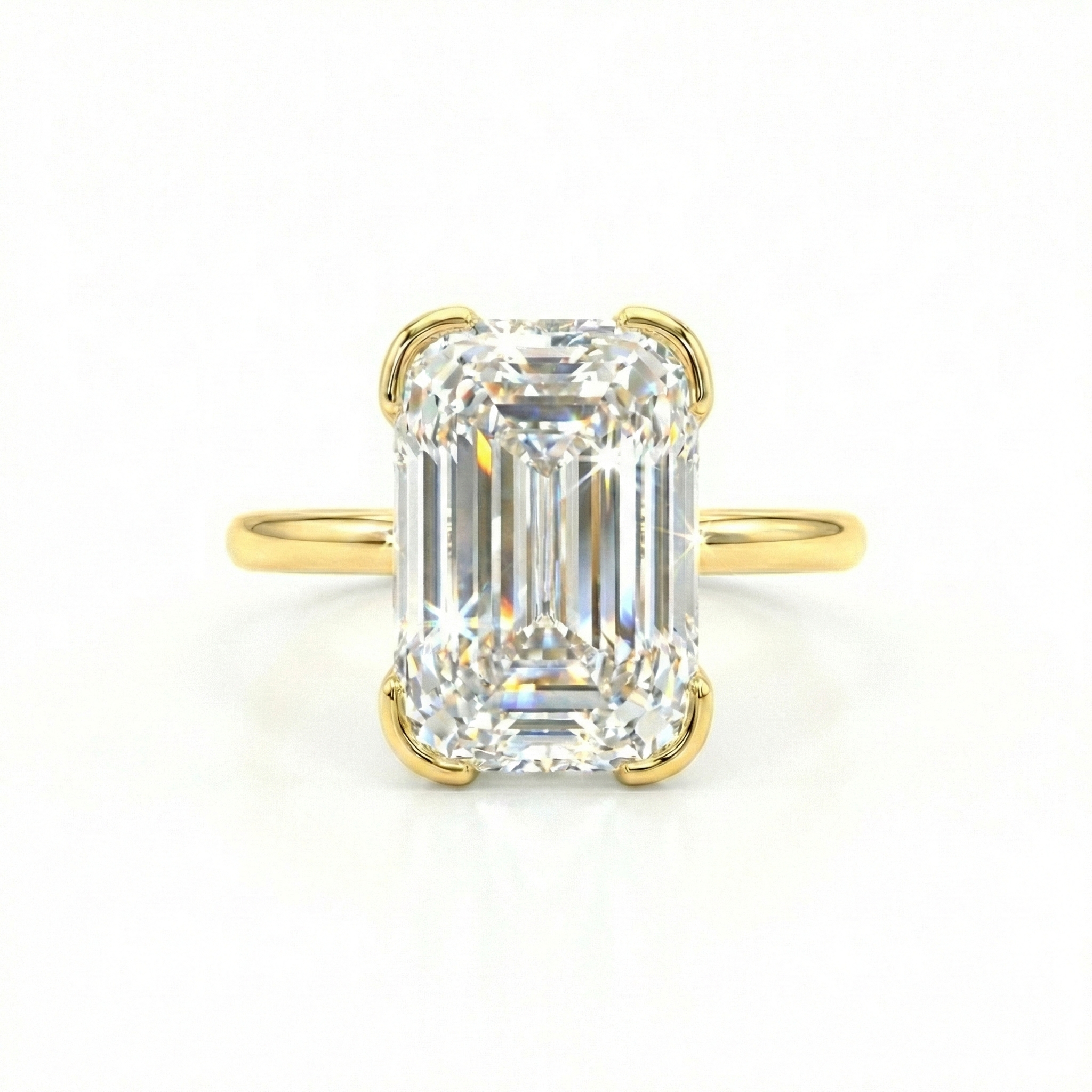 Top view of 3.13ct Ashoka cut lab grown diamond ring. Features 62 facets and elongated shape in 14K gold half-bezel setting.
