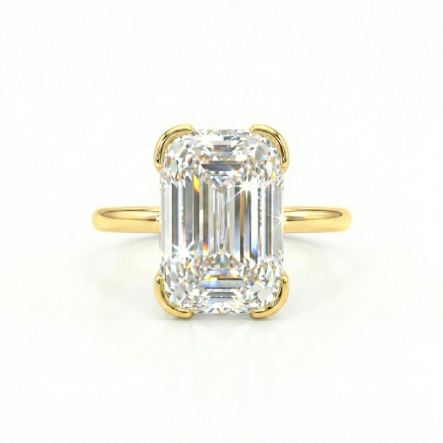 Top view of 3.13ct Ashoka cut lab grown diamond ring. Features 62 facets and elongated shape in 14K gold half-bezel setting.