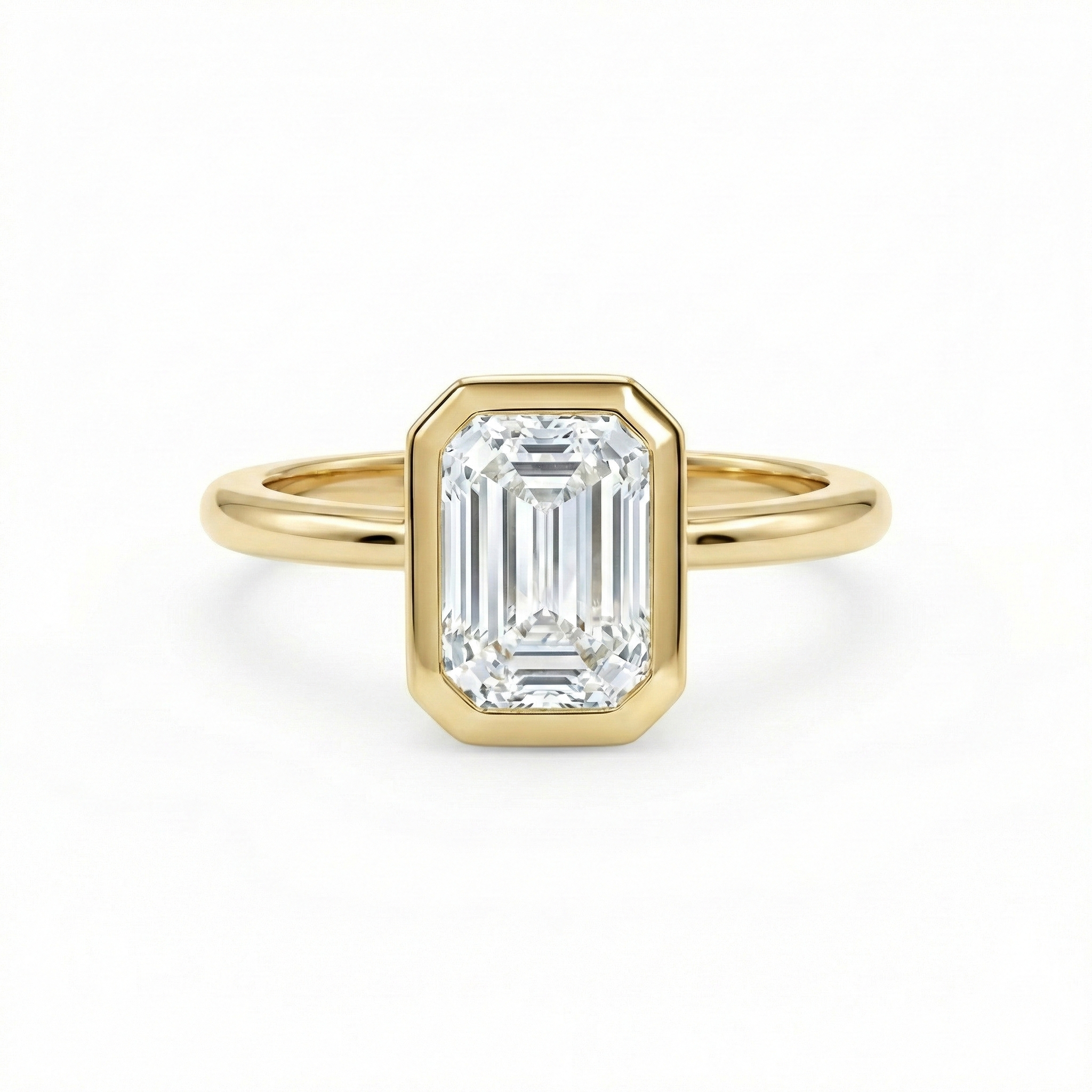 E color VVS2 clarity 1.5ct emerald cut lab diamond in a snag-free 14K gold bezel setting.
