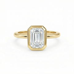 E color VVS2 clarity 1.5ct emerald cut lab diamond in a snag-free 14K gold bezel setting.