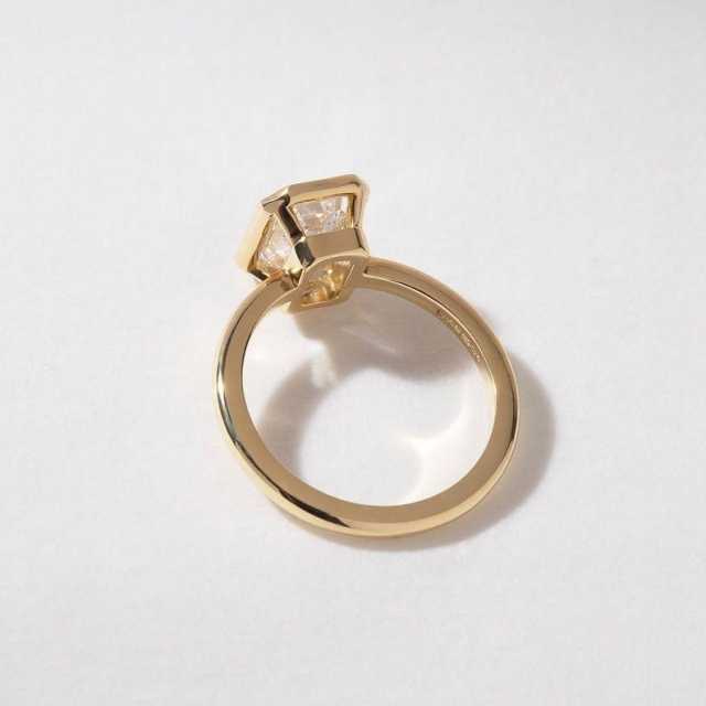Side profile showing the secure 14K gold bezel setting of a 1.5 carat emerald cut lab diamond ring.